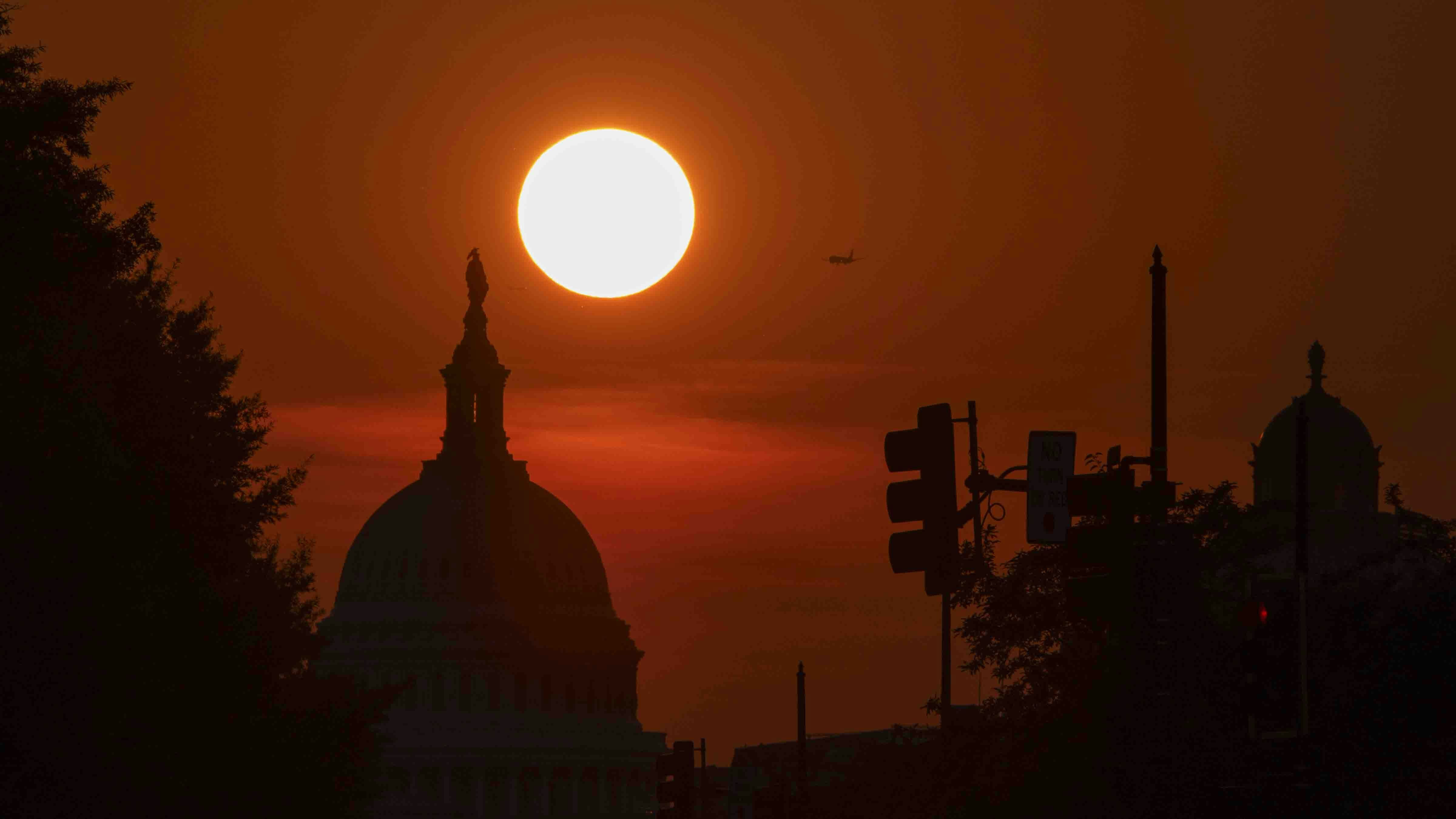 The sun sets behind the U.S. Capitol Building on June 11, 2025 in Washington, DC.
