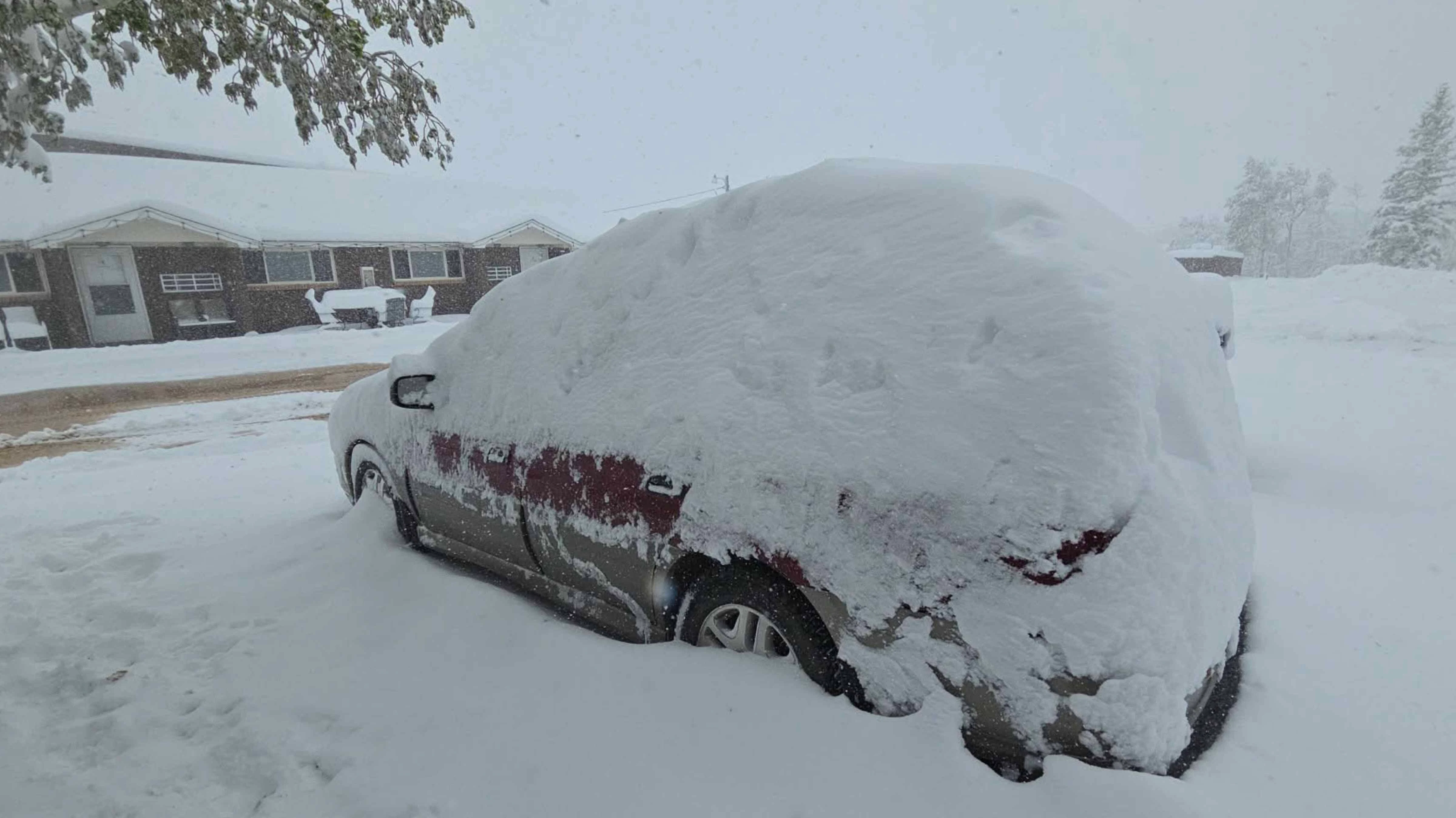 Snow outside The Friendly Store in Centennial, Wyoming, on Monday, May 18, 2026
