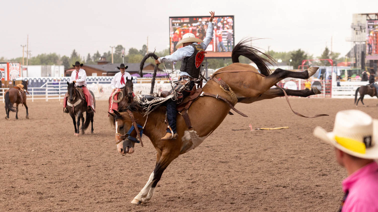 Kaden Miranda from Mule Creek, NM in the rookie saddle bronc riding at the rodeo at Cheyenne Frontier Days on Thursday, July 23.
