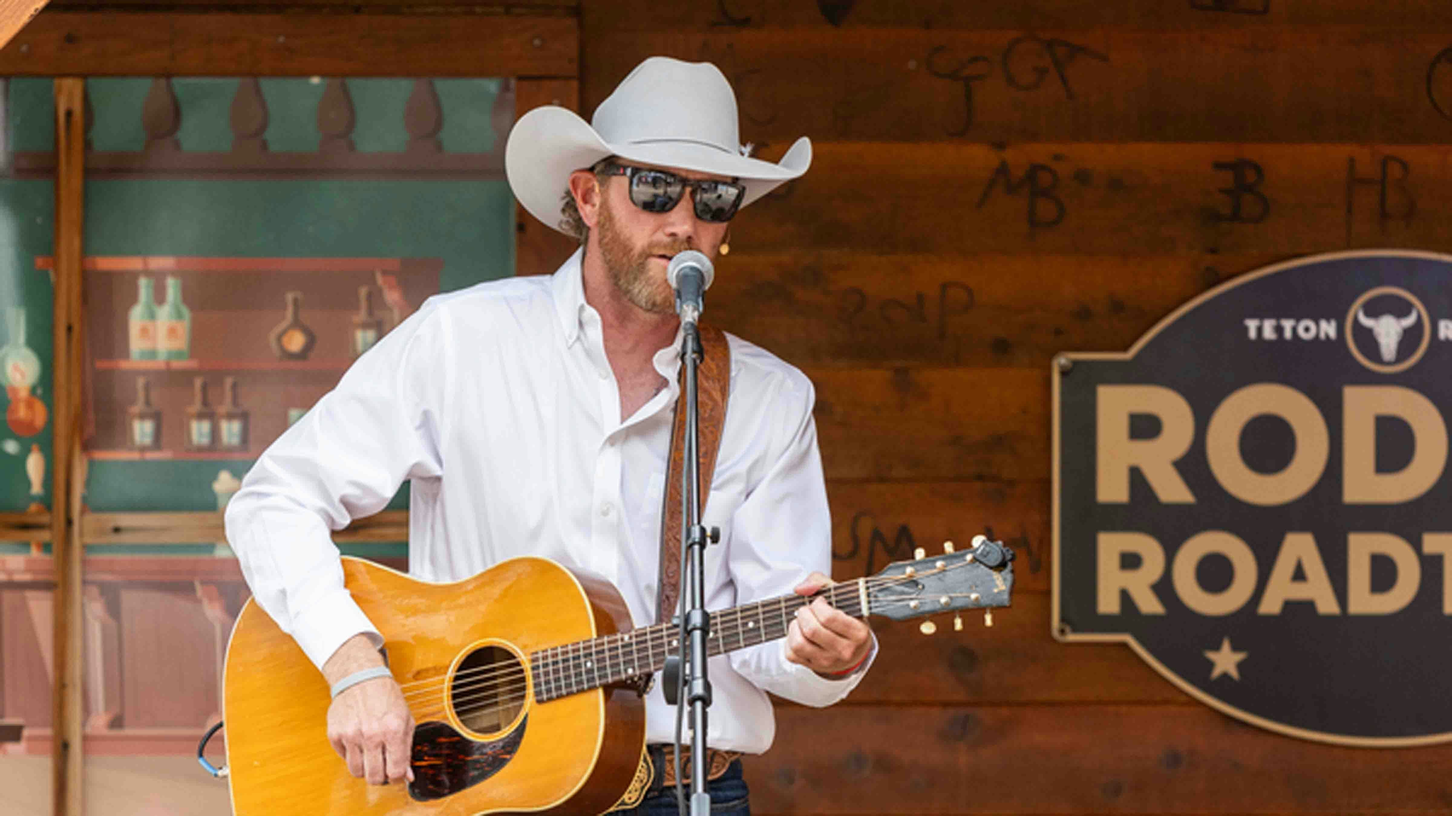 Chancey Williams sings and plays guitar at the Sidewinder Saloon in Old Frontier Town at Cheyenne Frontier Days during the Teton Ridge Rodeo Roadtrip Show on July 26, 2024.