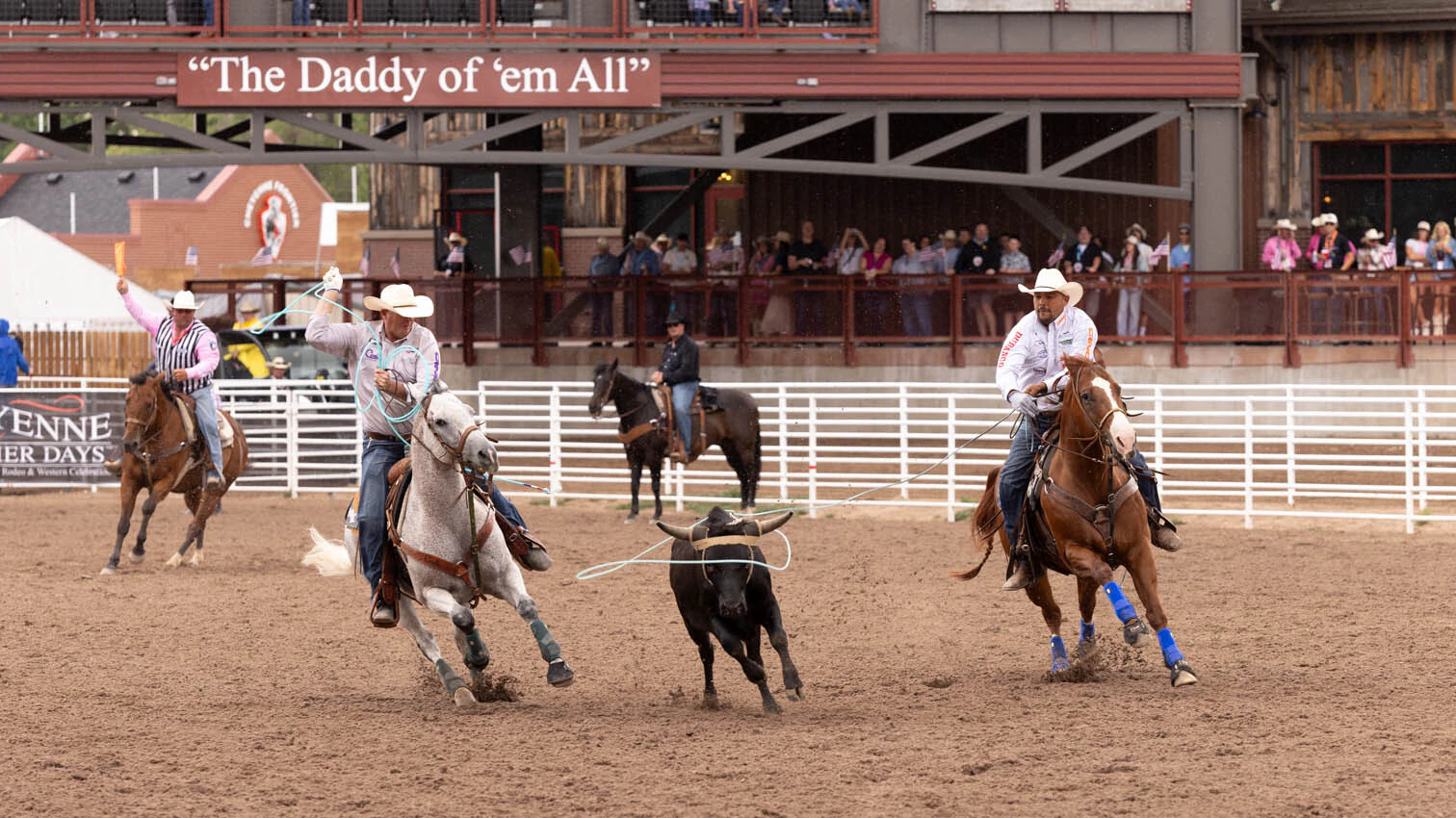 Erich Rogers from Round Rock, AZ and Cory Petska from Marana, AZ in the team roping at the rodeo at Cheyenne Frontier Days on Thursday, July 23.