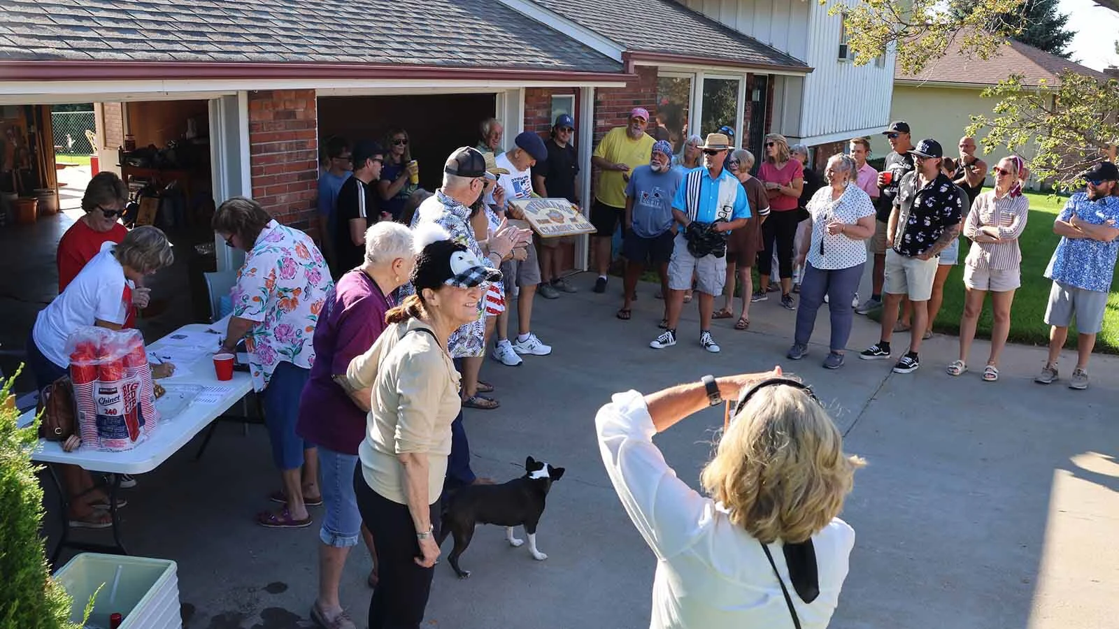 Members of the annual trek to Deadwood presented Frank Jones with an engraved signs for his Wyoming Classic Cars brand.