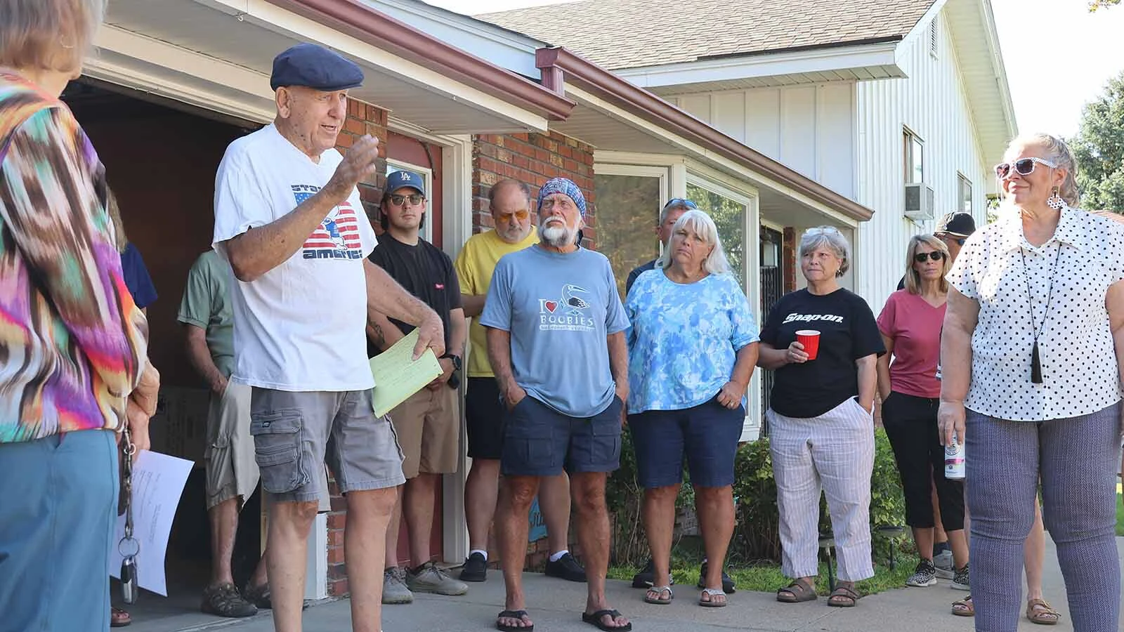 Frank Jones, second from left, leads a drivers’ meeting before everyone heads for Deadwood. 