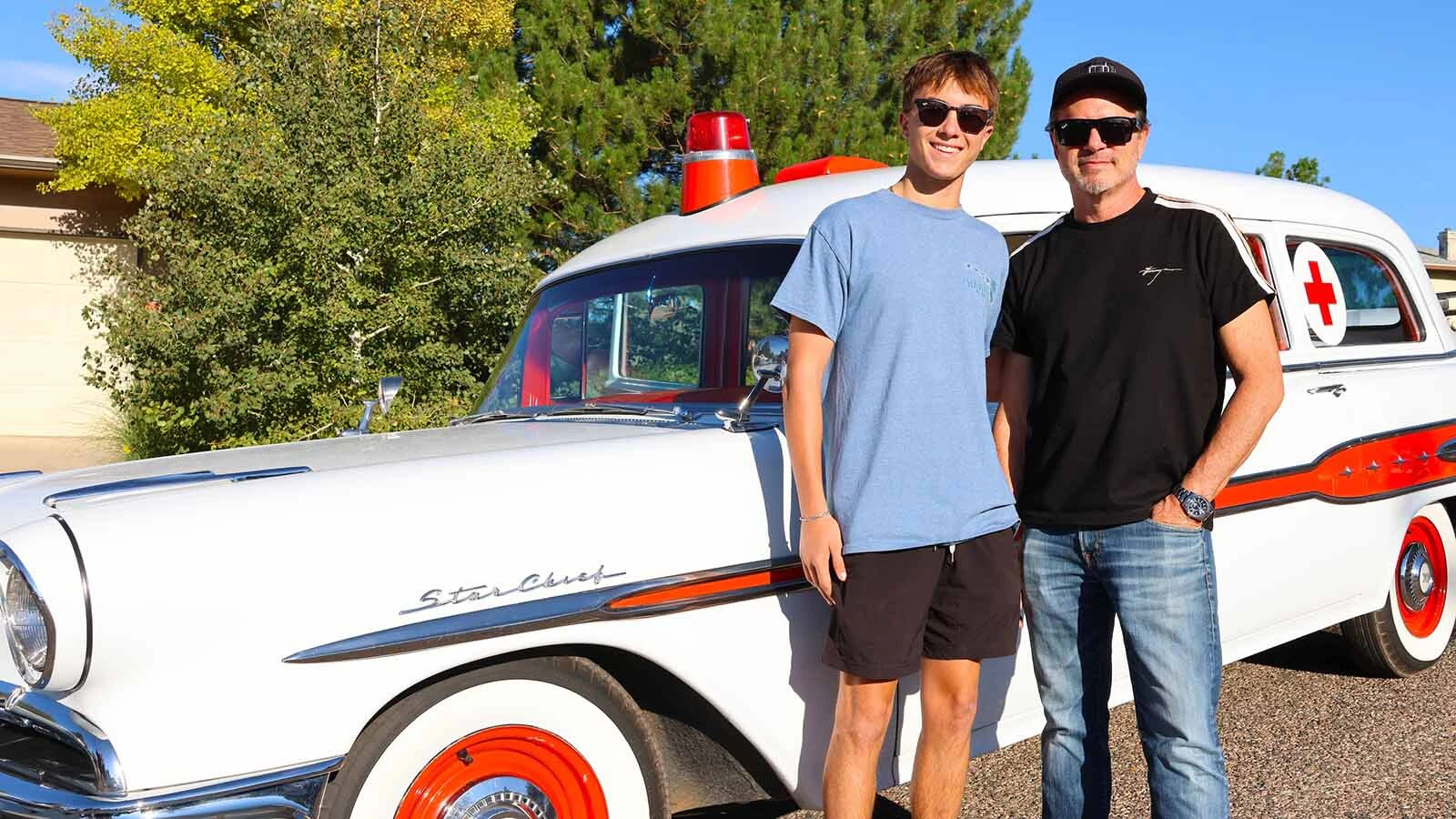 Cole, left, and Dr. Mark Howshar drove the 1956 Pontiac Star Chief ambulance that honors the late Dr. Ed Howshar.