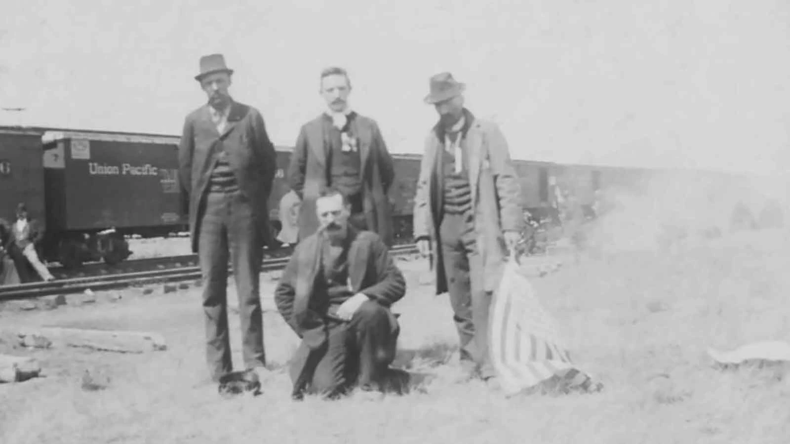 On April 12, 1894, the Laramie Republican reported 27 box cars filled with an early contingent of 1200 Coxeyites heading toward Wyoming from Utah. When they “whizzed through” Laramie and camped at Red Buttes south of town, they drew a large, sympathetic crowd. These four are along the railroad outside Laramie.