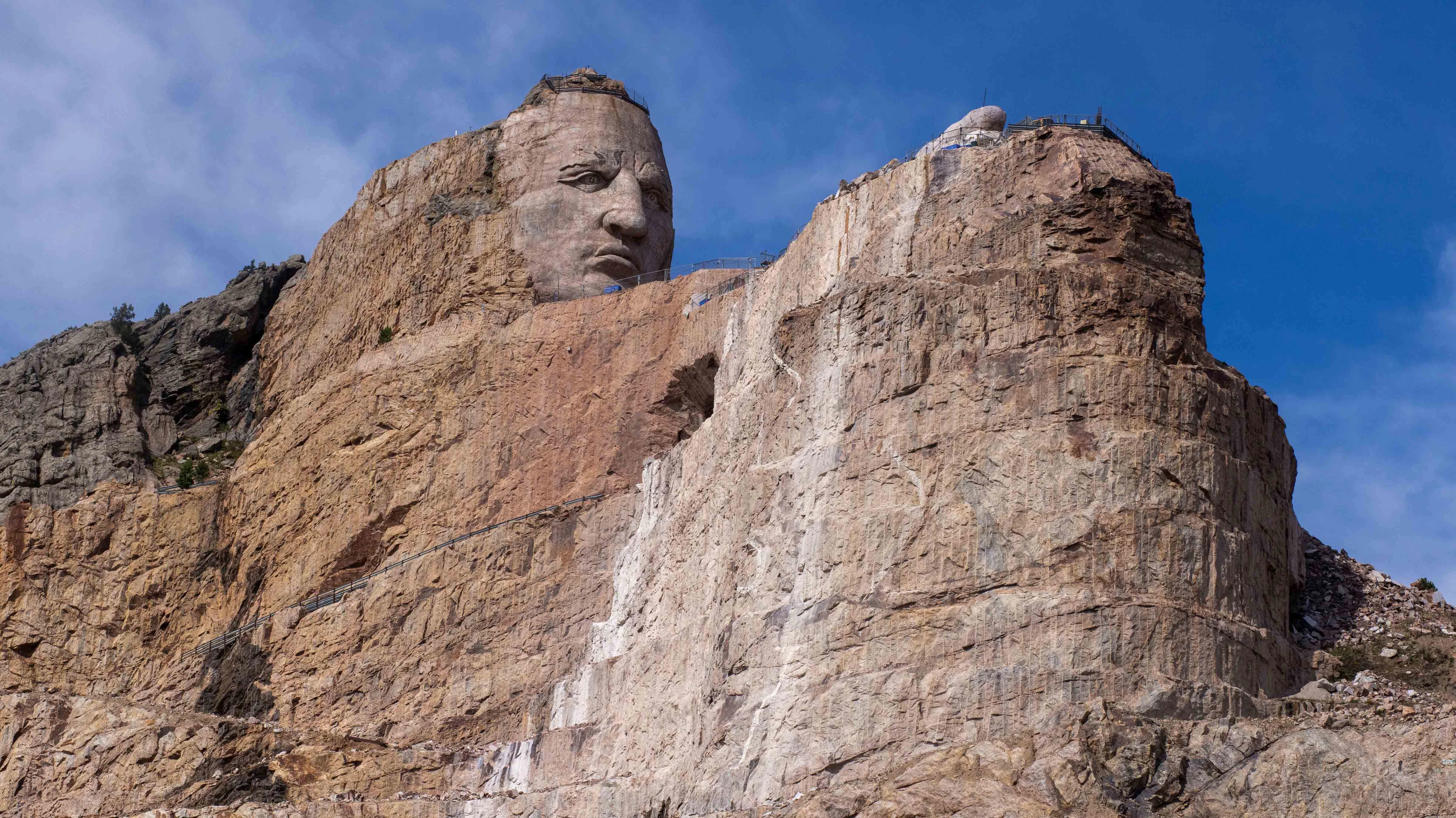 The first lesson of Crazy Horse Memorial: Everything here is bigger than you think.  The carving itself is larger than nearby Mount Rushmore, with the American Indian’s head outsizing the 60-foot-tall heads of its presidential neighbors.