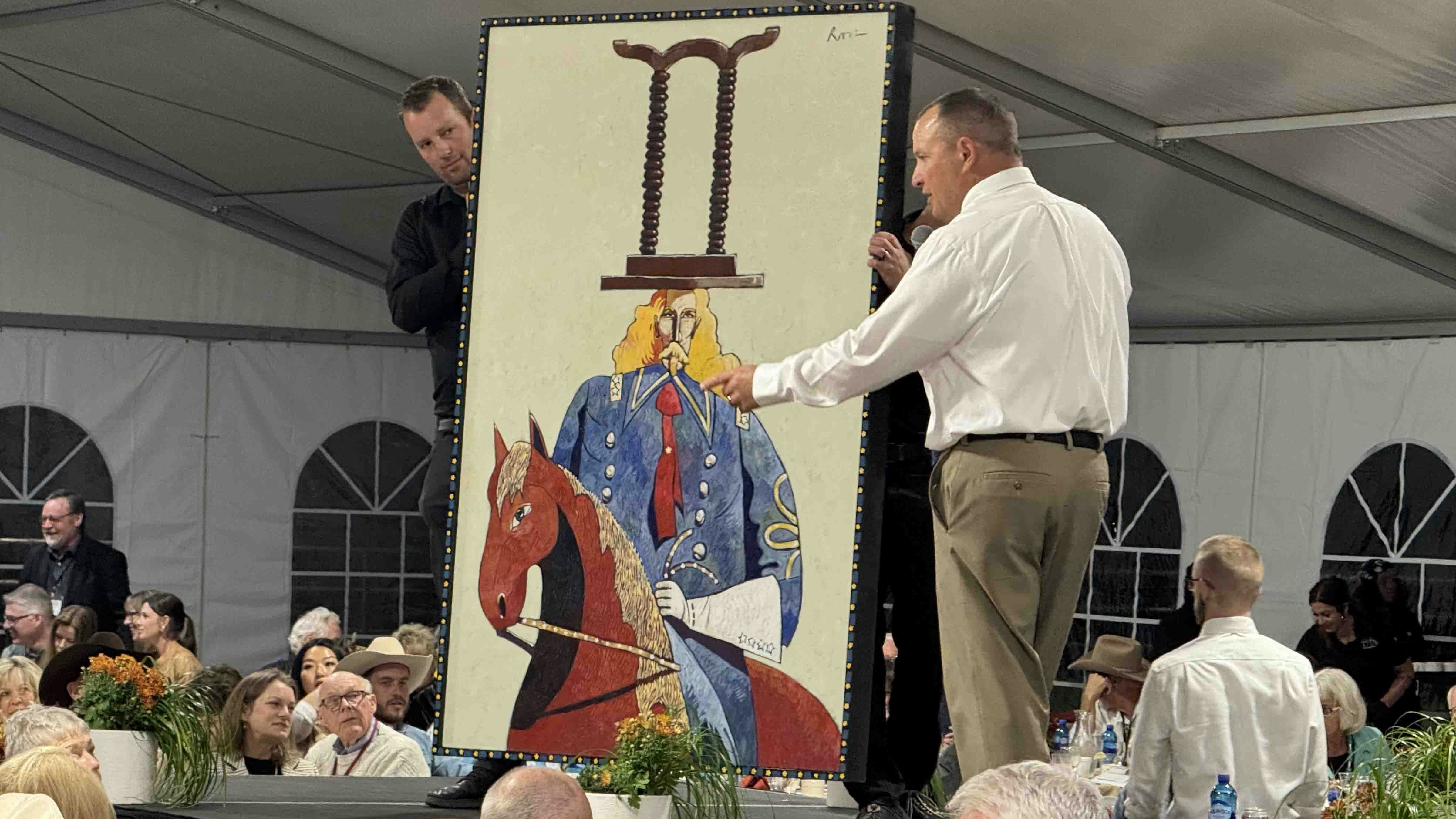 "Custer & the Table," an acrylic painting by Thom Ross, on the runway during the 44th Buffalo Bill Art Show and Sale in Cody.