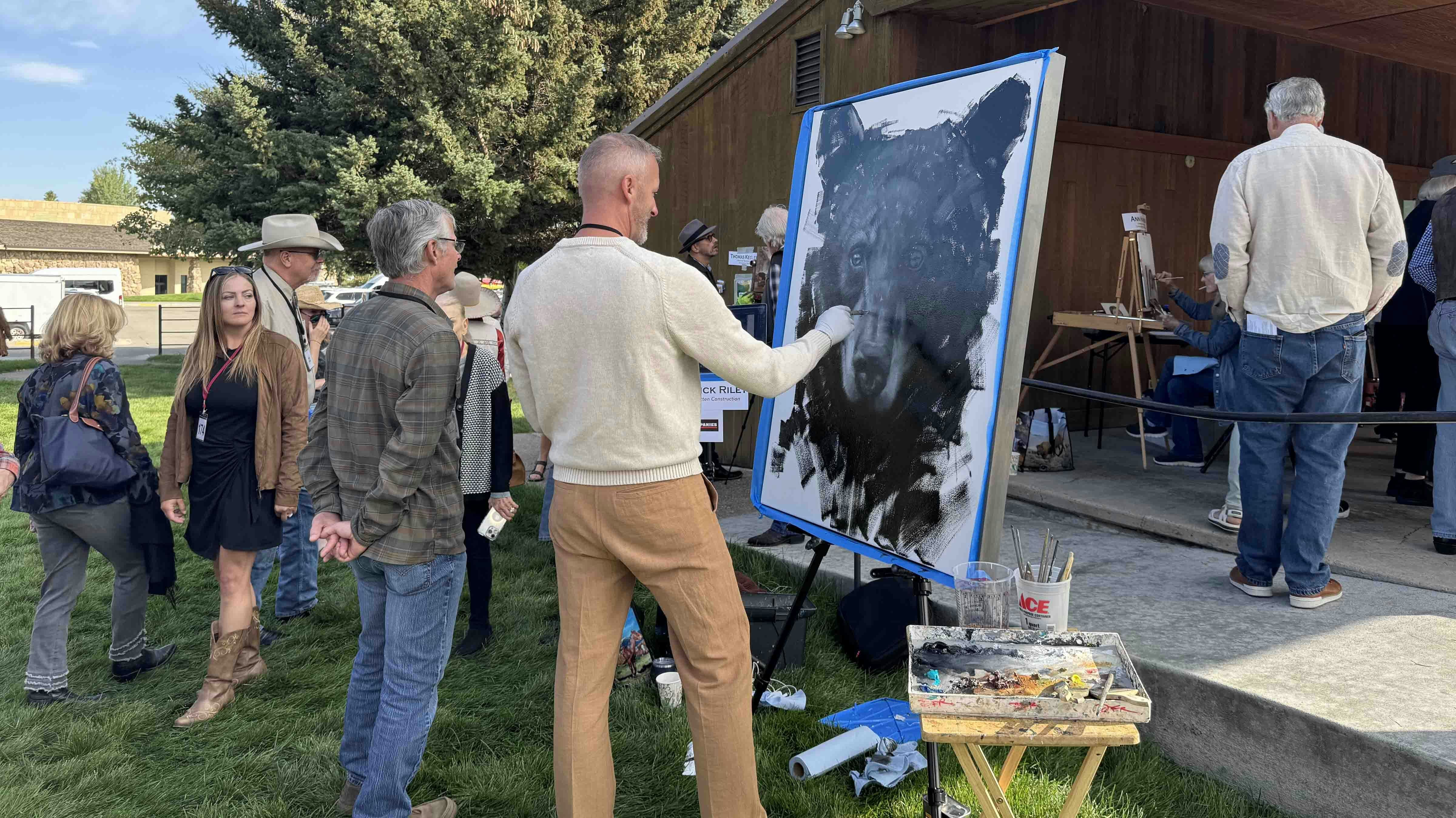 David Frederick Riley works on a painting of a black bear during the 44th Buffalo Bill Art Show and Sale's Saturday morning Quick Draw. His piece sold for $25,000 and won the 2025 Quick Draw's People's Choice Award.