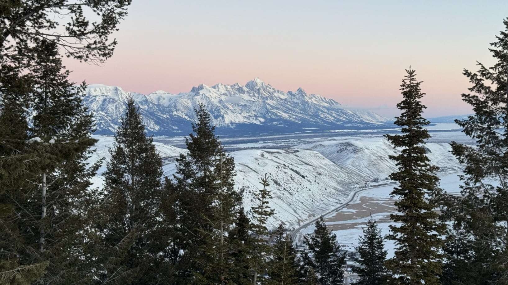 "This photo is taken by Marc Domsky from Jackson. He is looking at the Tetons from the top of Snow King Mountain. He likes to “skin” up and ski down in the very early morning. Not too many people around at -10 degrees . It’s beautiful!