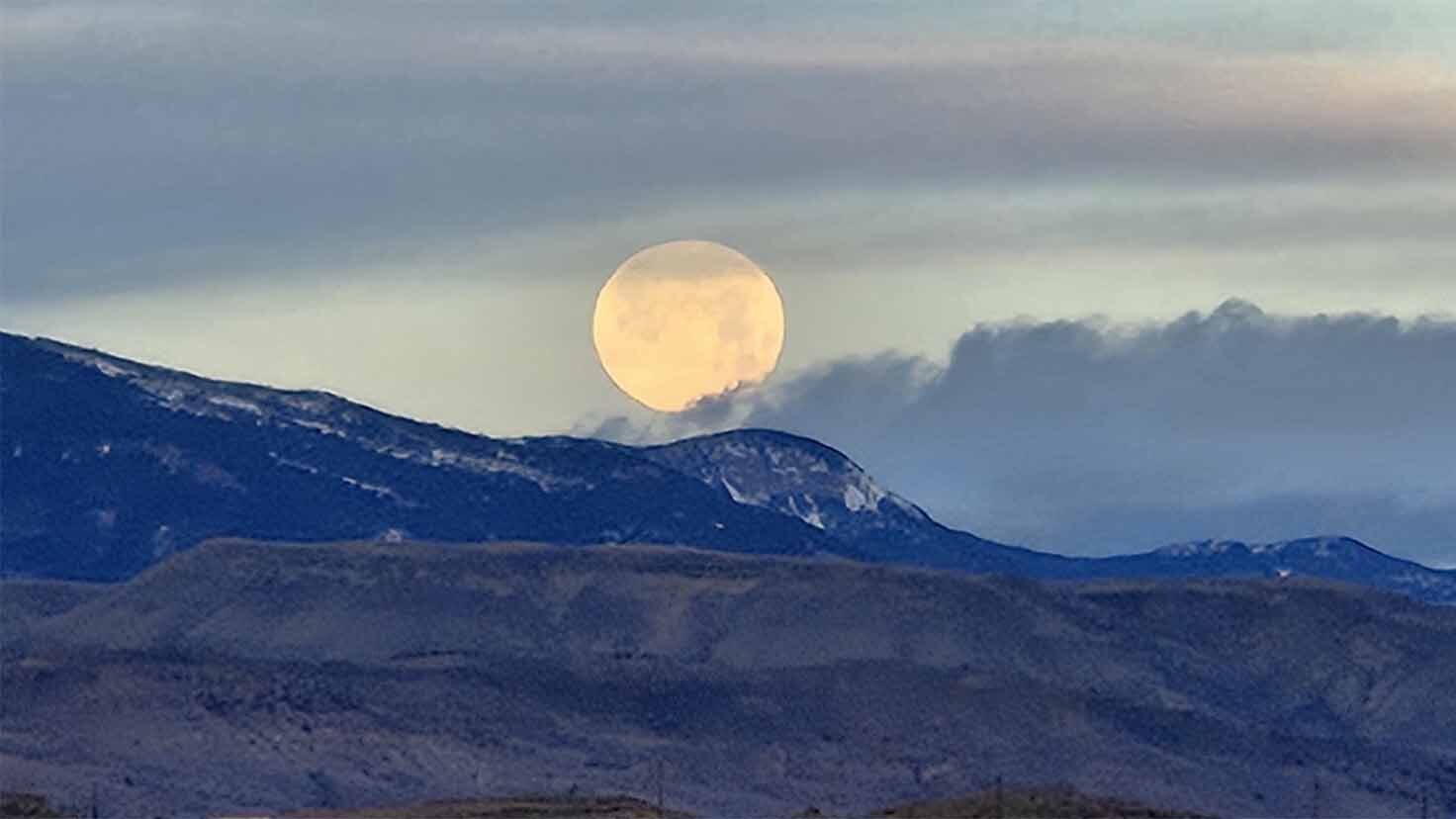 "Magnificent morning moon. Taken in the back pasture. Cody, Wyoming."