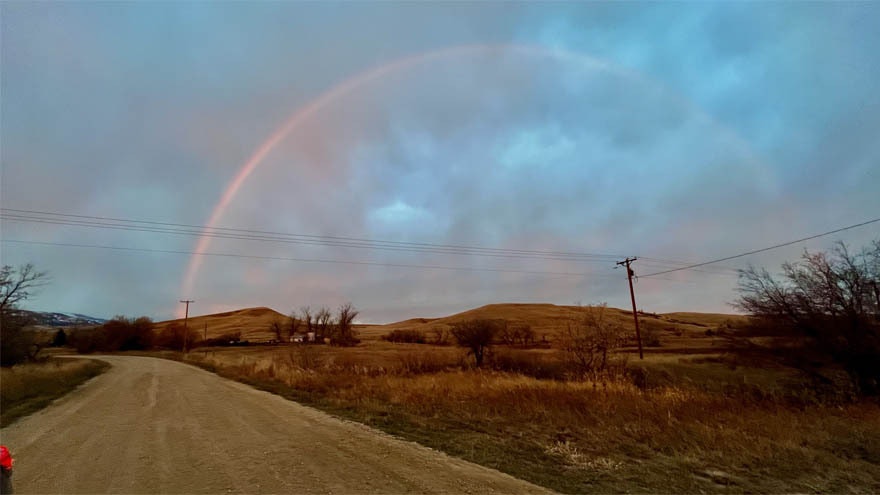 "Just at sunrise in Banner, I saw this monochromatic rainbow to the west, over the Bighorns."