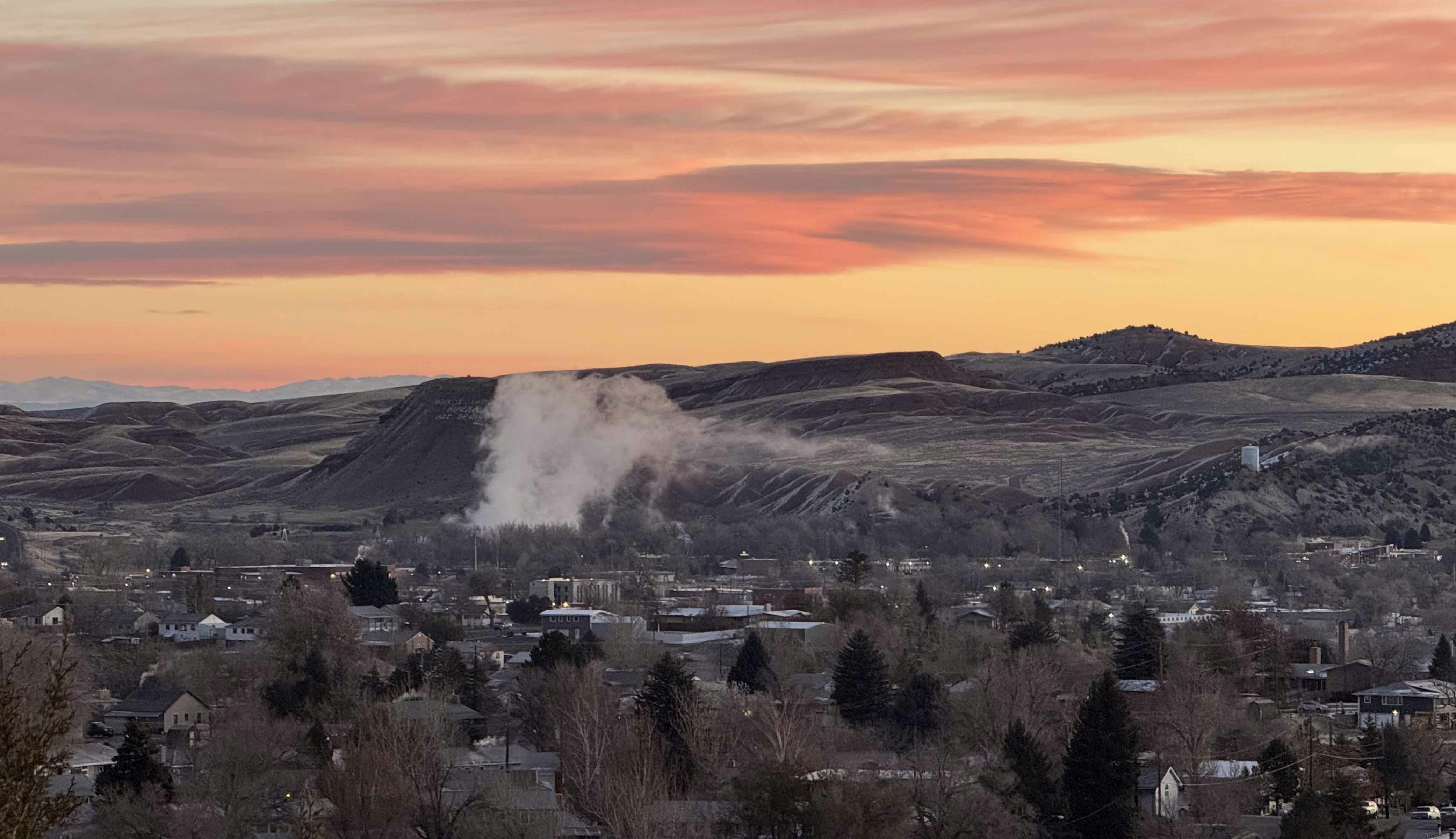 Steam rises up the face of Monument Hill from the Big Horn Hot Spring in Thermopolis on a cold November morning.