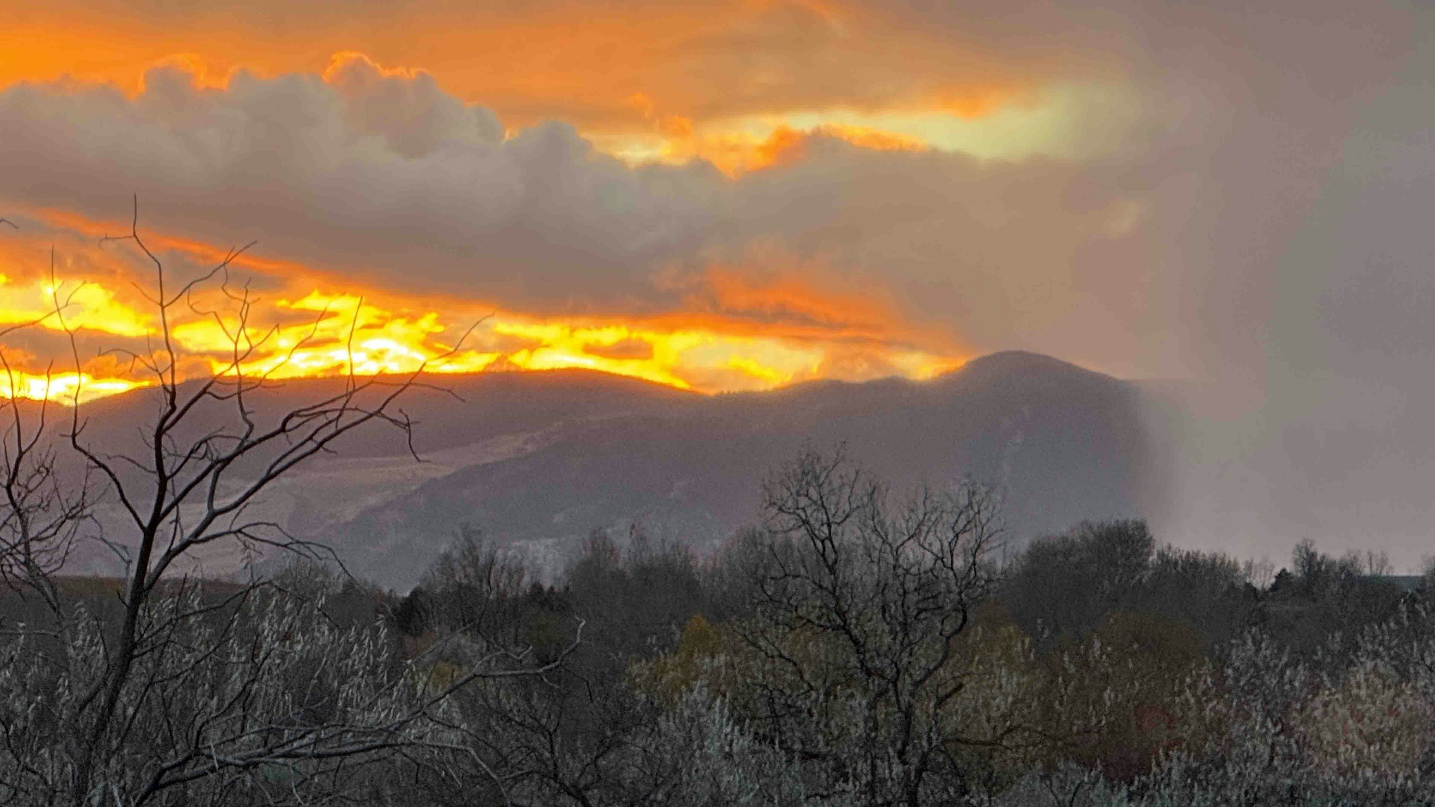 "The sun was setting over the Bighorn Mountains while a storm was also passing through. I love Wyoming skies!"