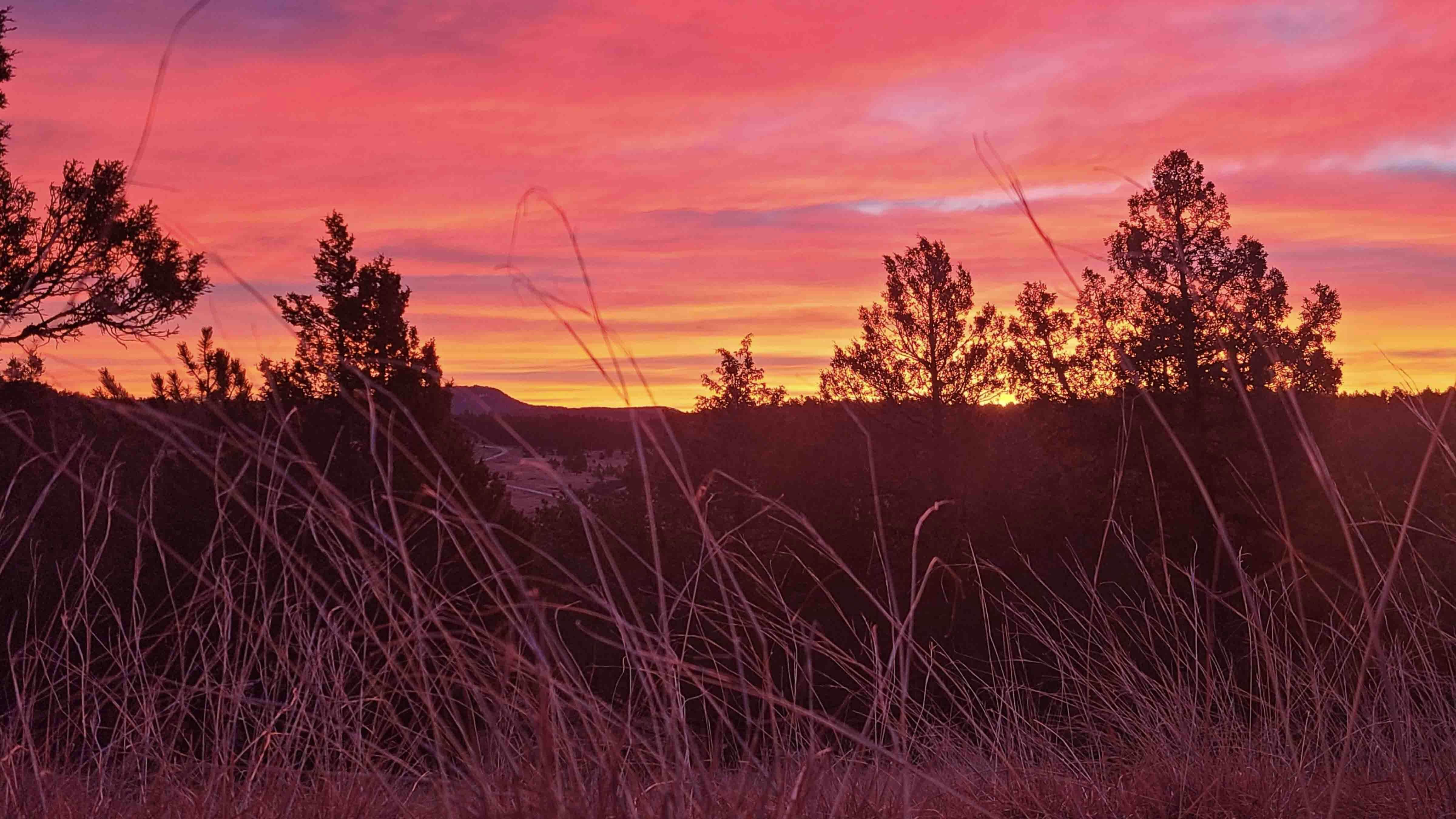 From our home, 16 miles south of Sundance, I captured this morning's sky about 10 minutes before the sun actually began to peak above the distant Inyan Kara Mountain ridgeline.