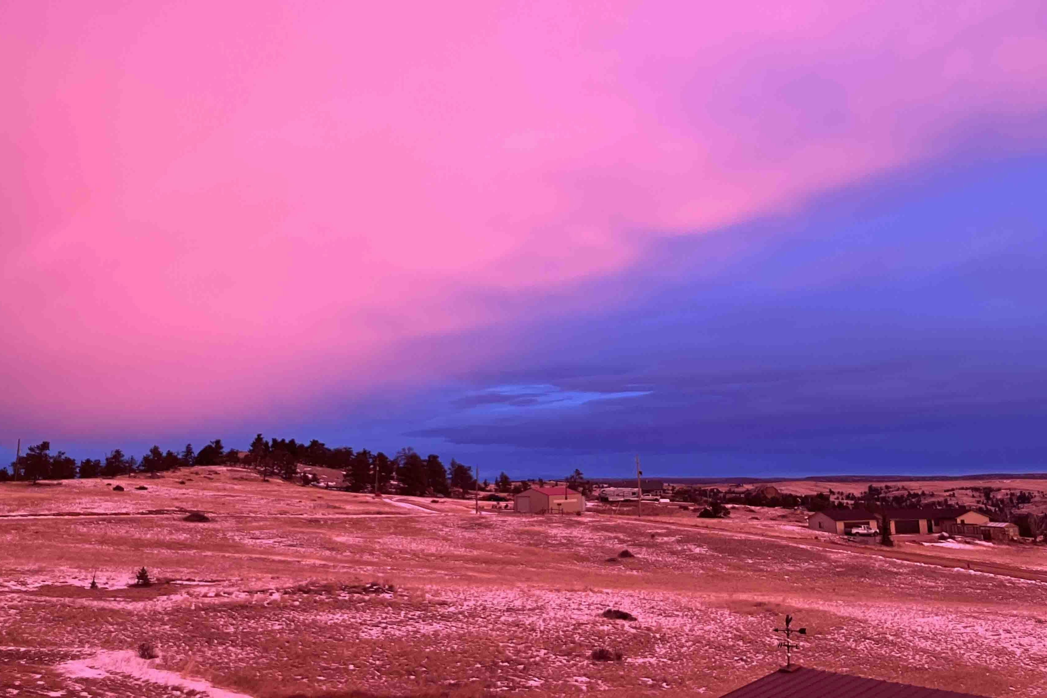 Surreal colors this morning, storm approaching at sunrise at 7am on Dec 4. Mountain Meadow, Cheyenne