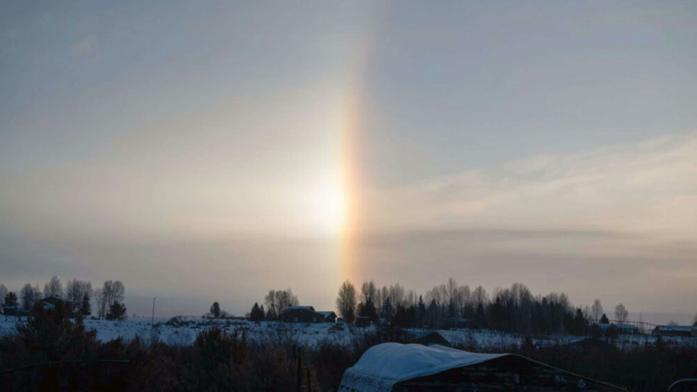 "It's a snow cold rainbow. Right off the back porch." Pinedale, WY