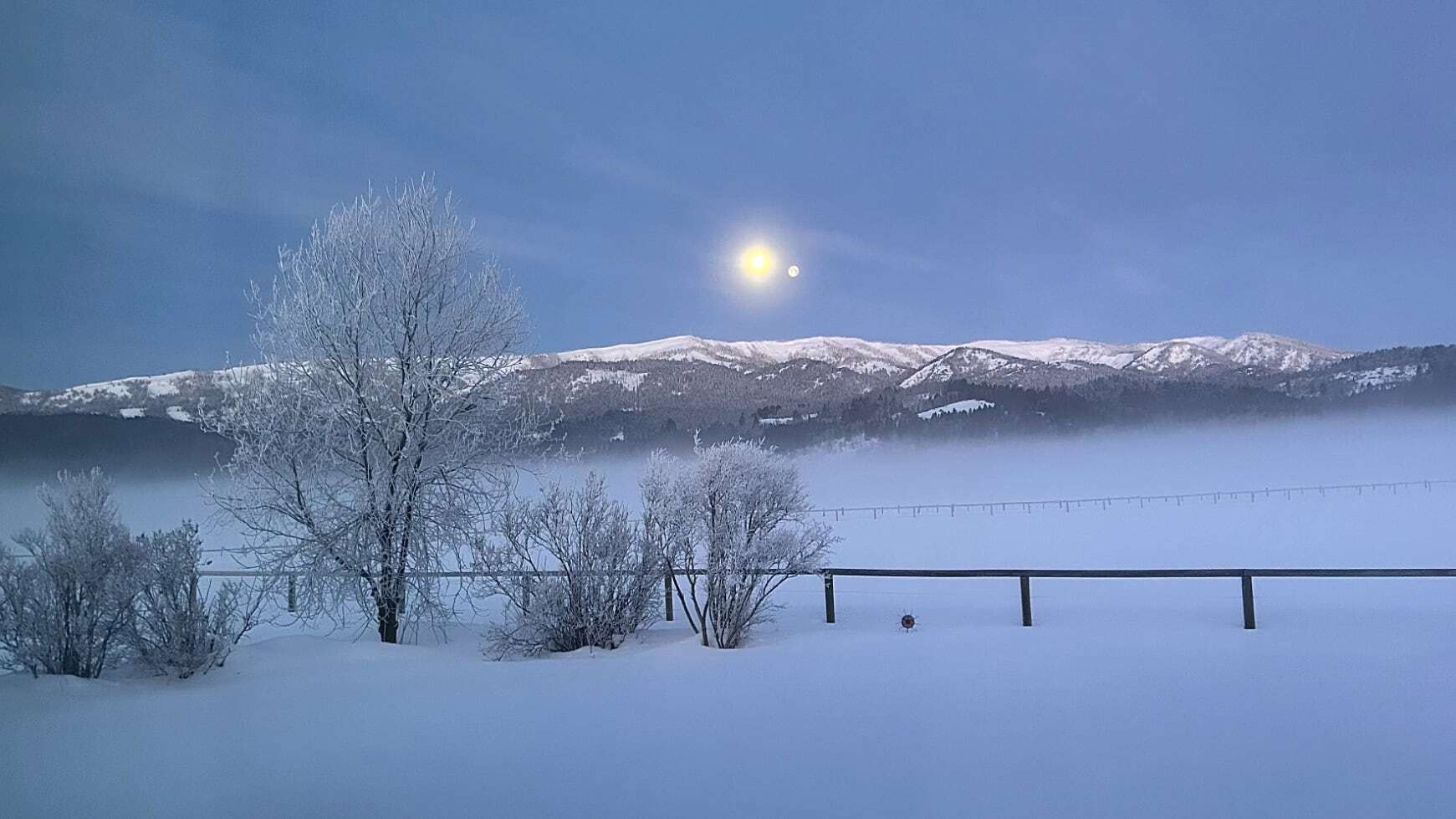 "Sunrise/moonset over Black Mtn. in Alpine. Temp. -16F"