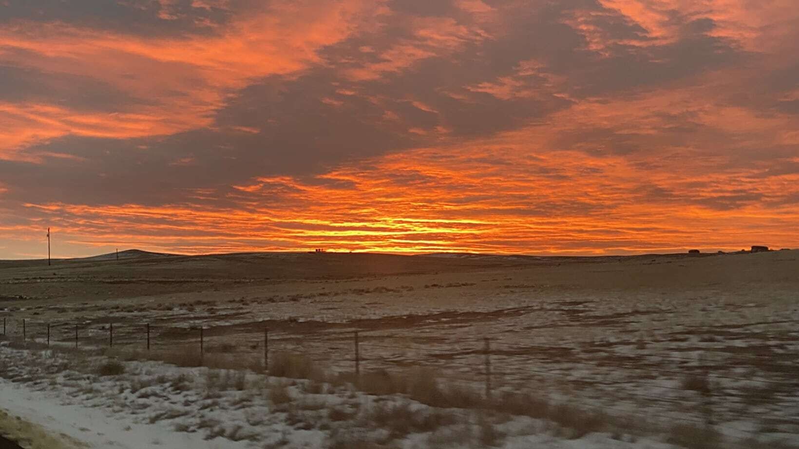 "This was taken about 7 miles east of Douglas, WY on the grassland. I love the grassland sunrises and sunsets where the sky is vast and the colors intense. Beautiful morning."