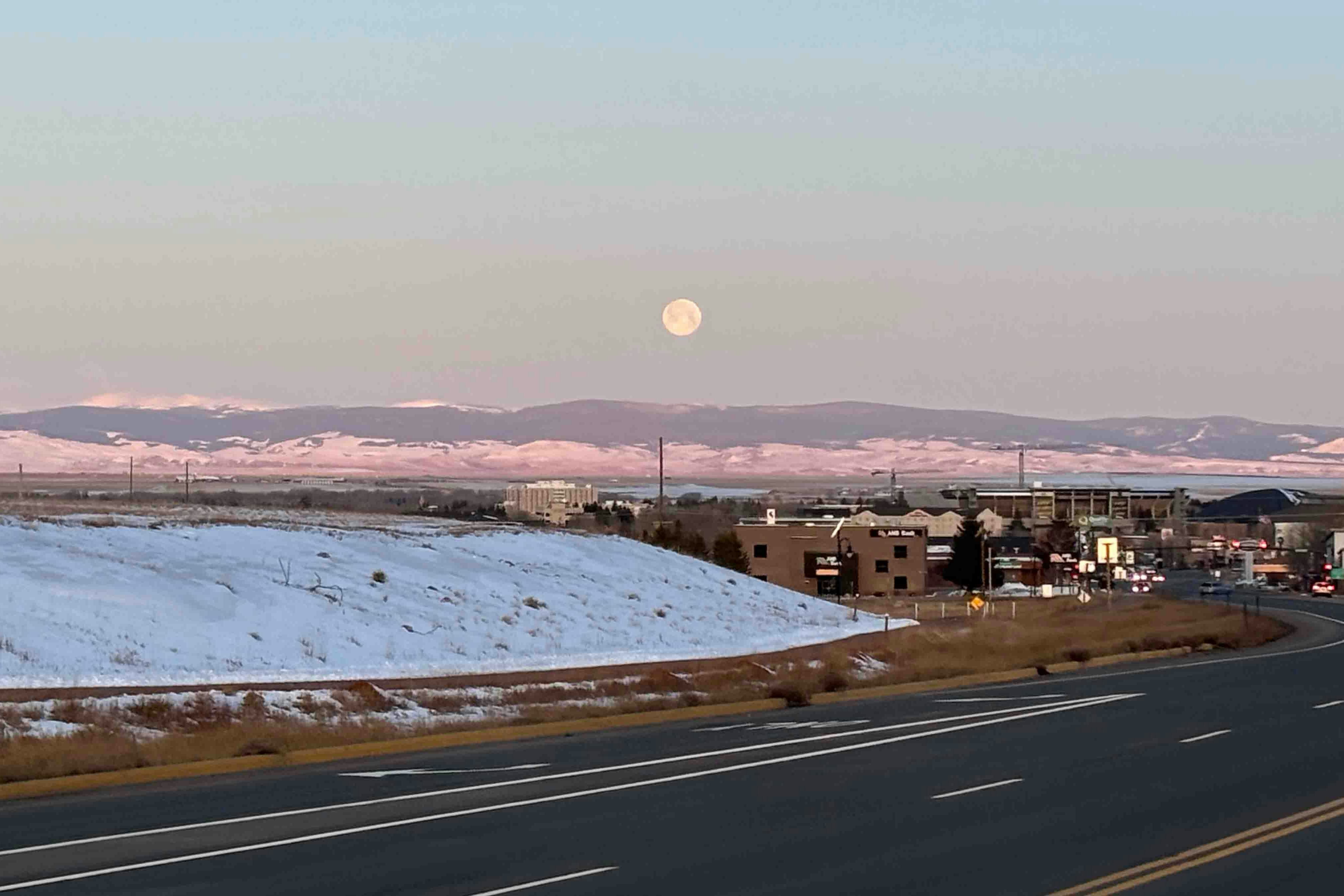 Sunrise with full moon over Laramie on Feb 24, 2024