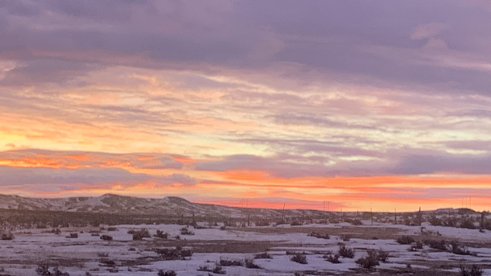 "We had a beautiful sunrise over the prairie this morning. Looks like we will have another warm day to melt the snow. I took this photo out my back door, south of Newcastle."