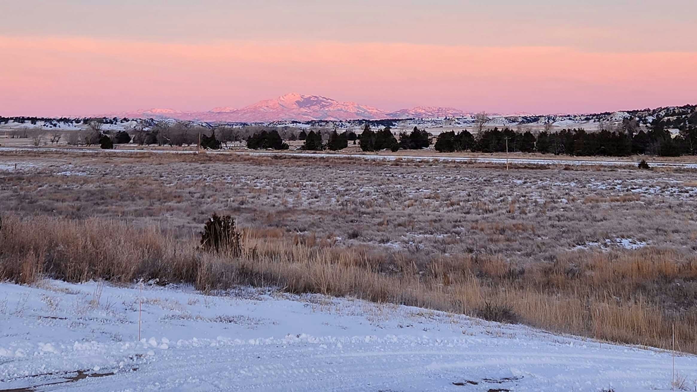 Reader photo: "Guernsey sunrise with Laramie Peak from outside of my home."