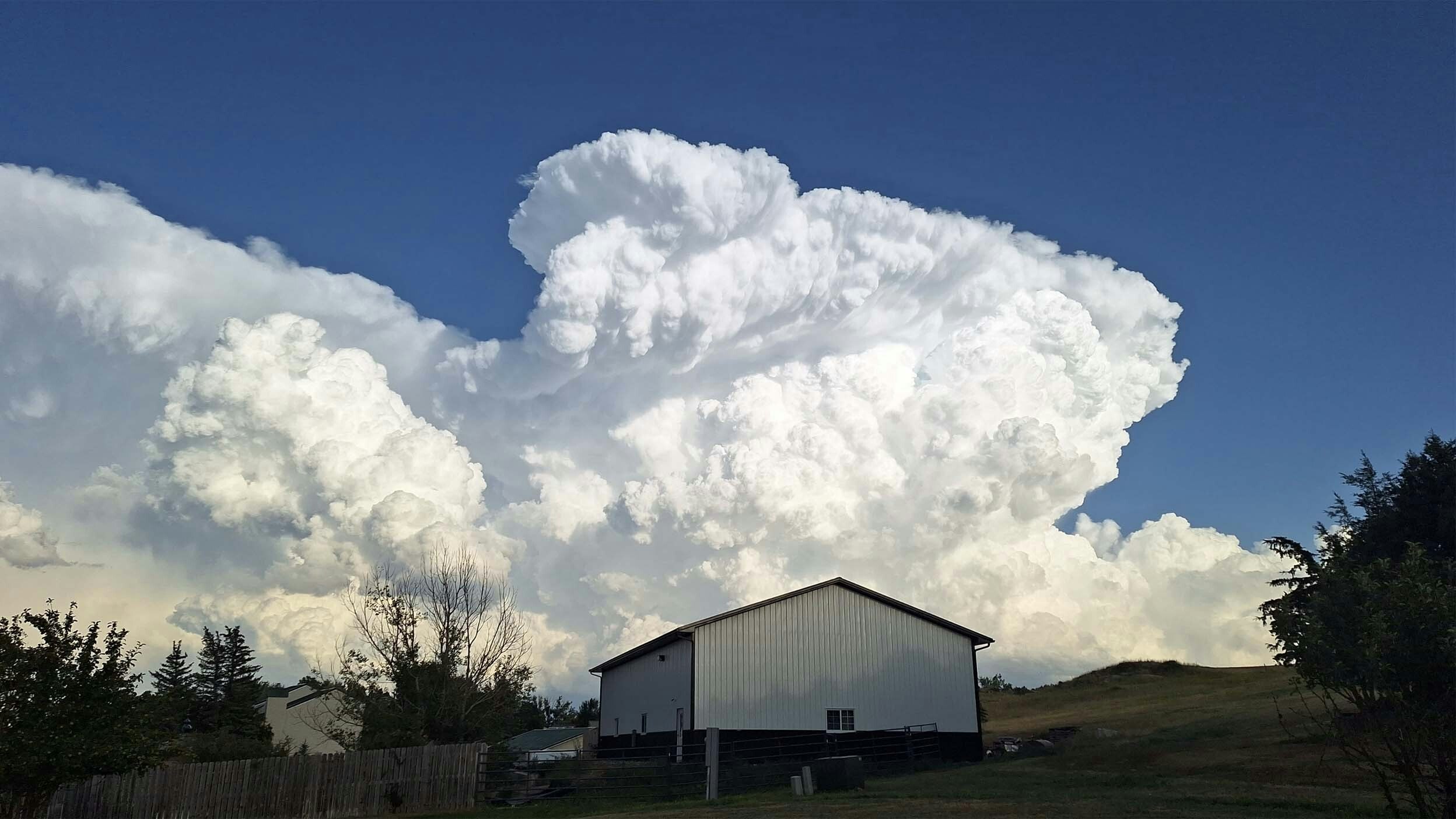Thunderstorm clouds southeast of Gillette, Wyoming at 7:20pm on July 30, 2023.