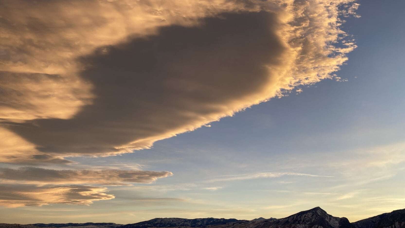 ​ "An interesting cloud highlighted by the sunset light." Clark, WY