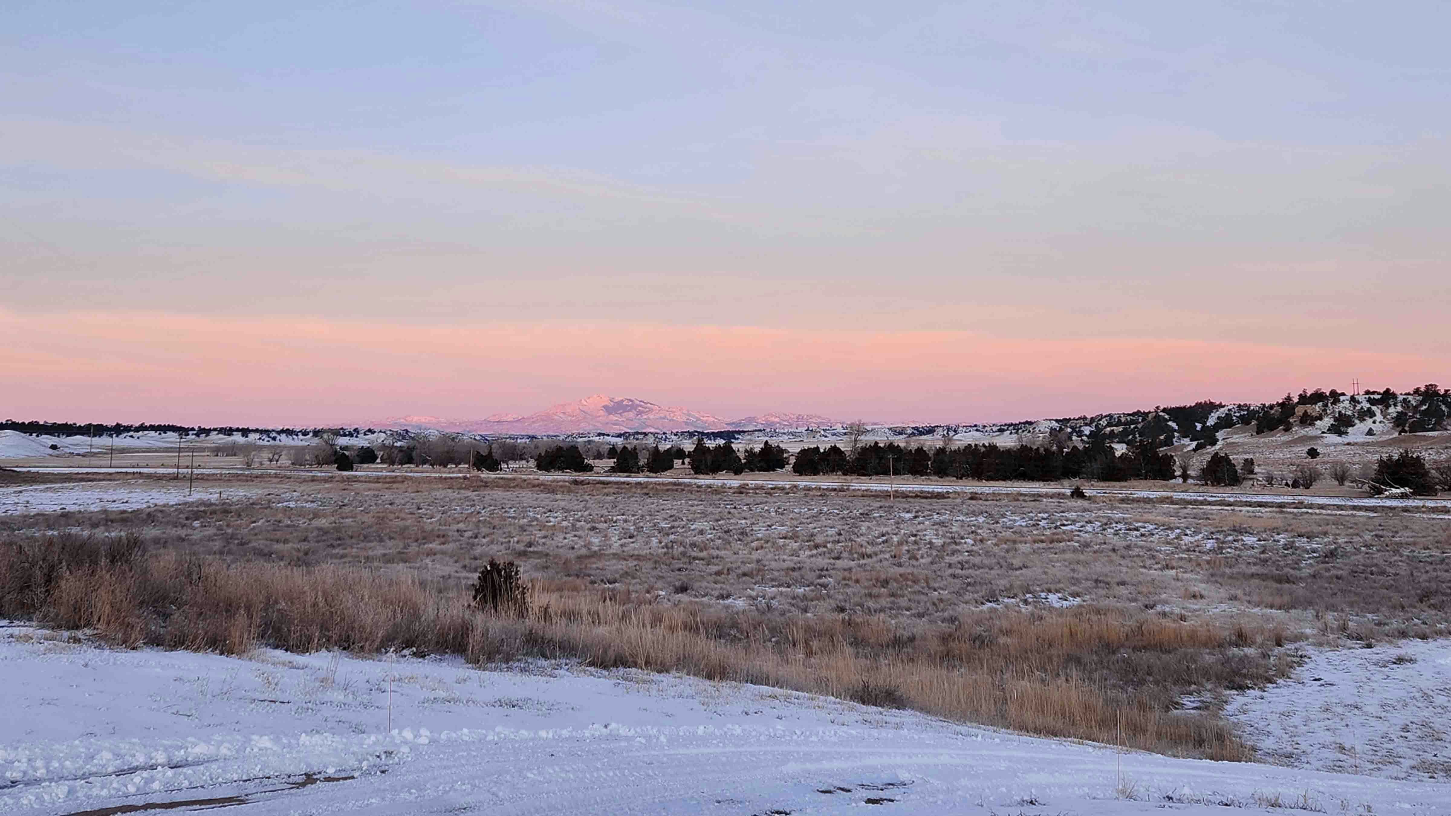 "Guernsey sunrise with Laramie Peak from outside of my home."