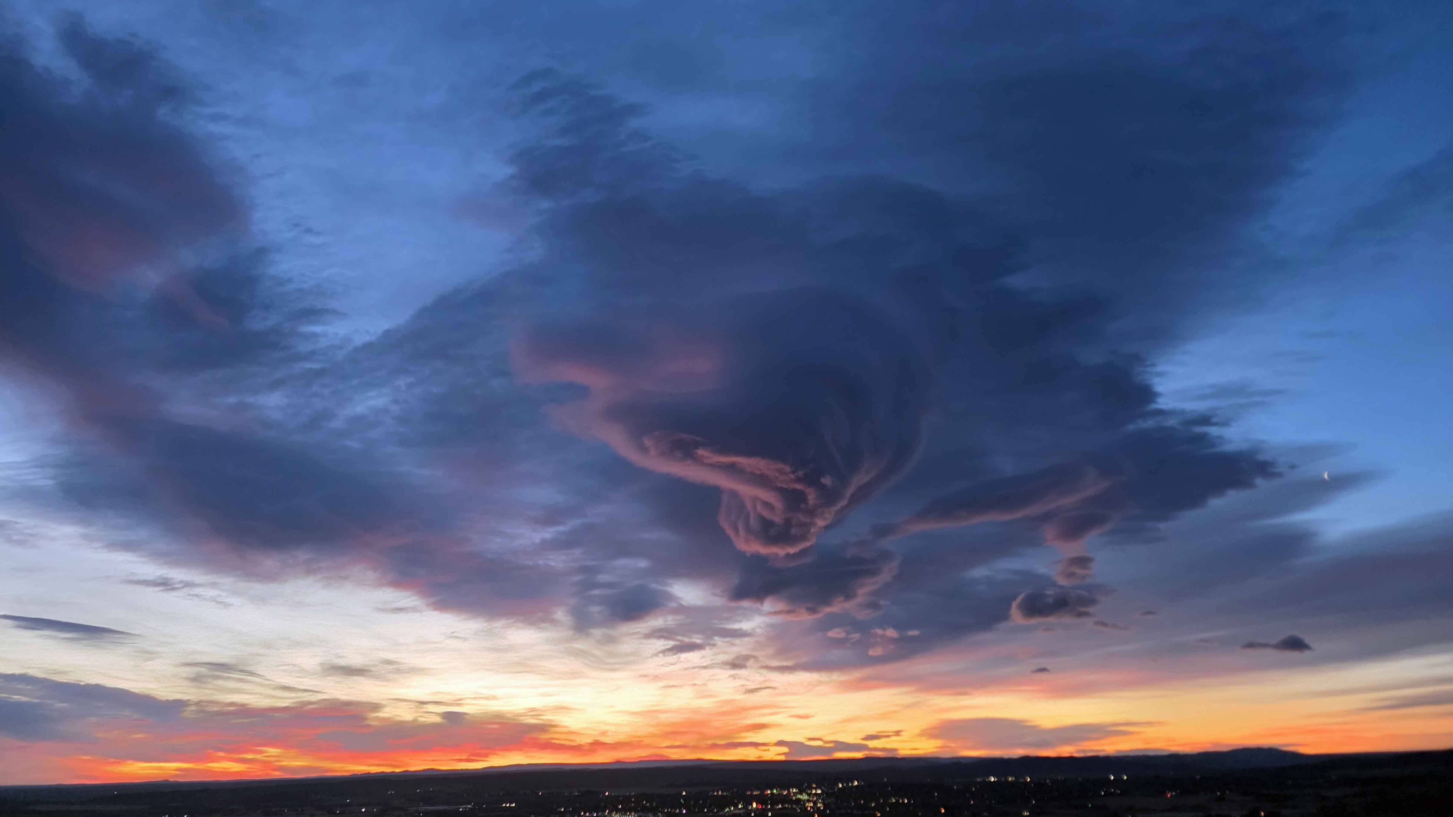 "Fascinating clouds and 76 mph wind. Sunrise over Lander."