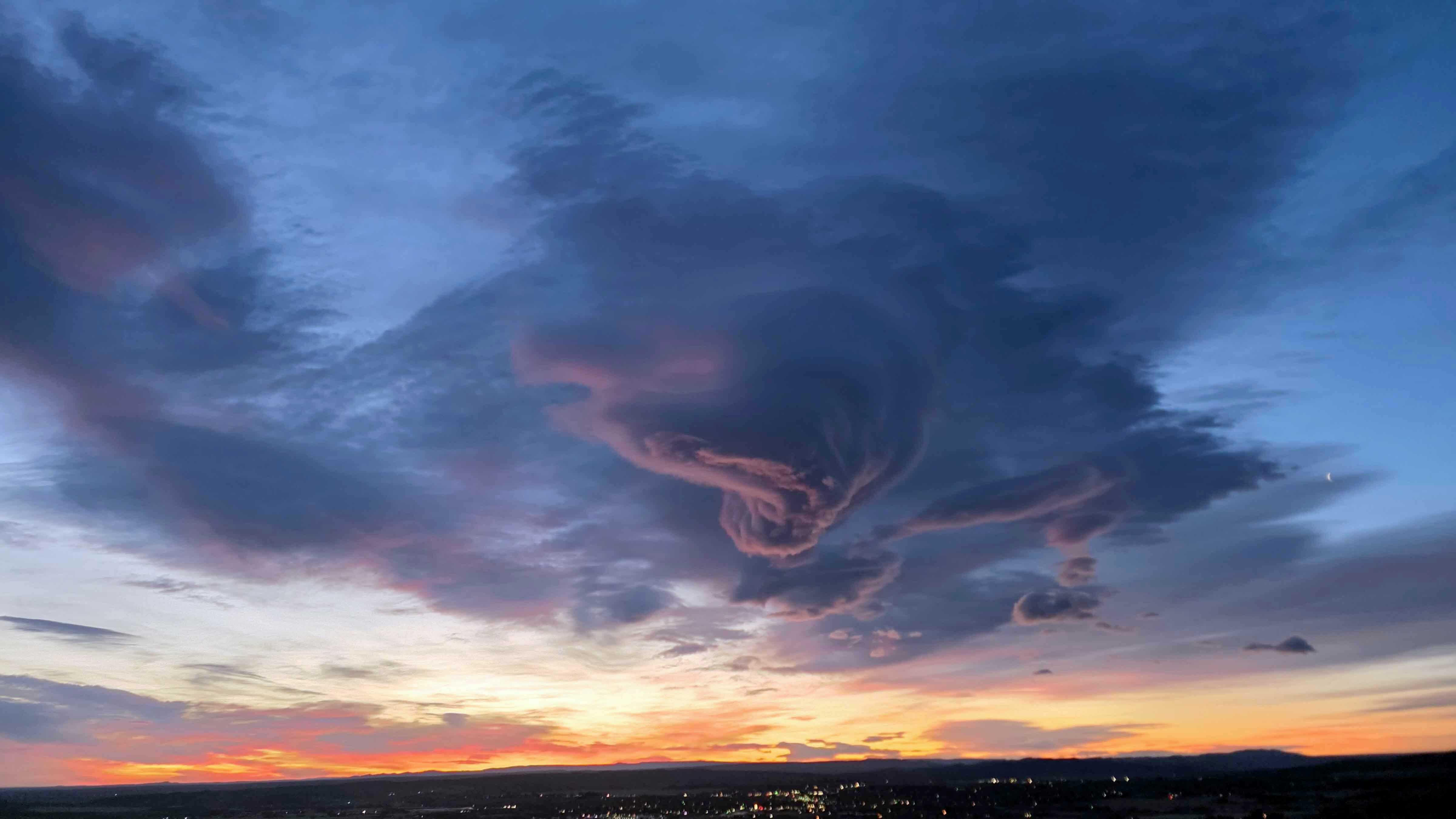 "Fascinating clouds and 76 mph wind. Sunrise over Lander."