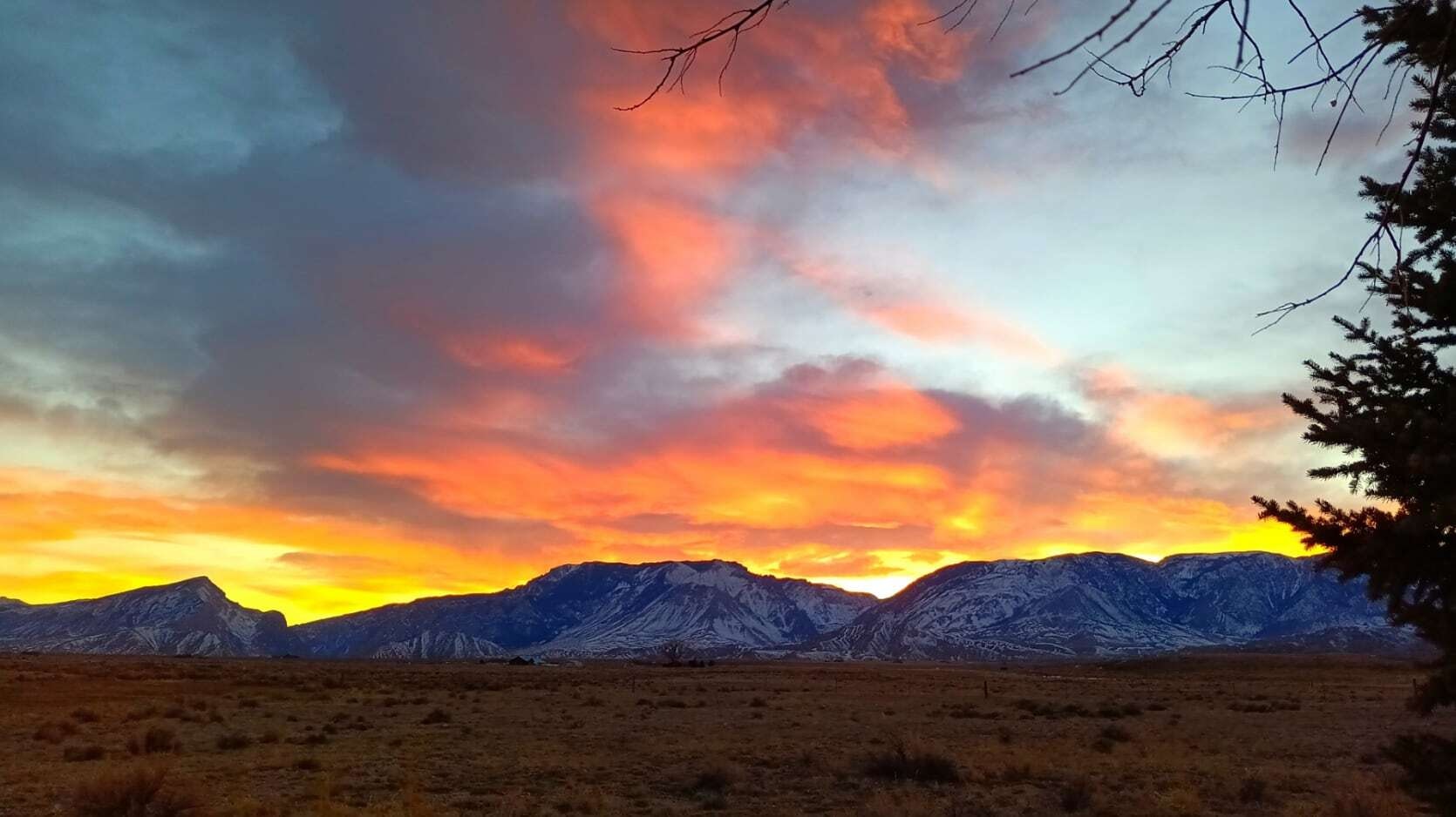 "Sunset over the Beartooth Mountains looking west from Clark."