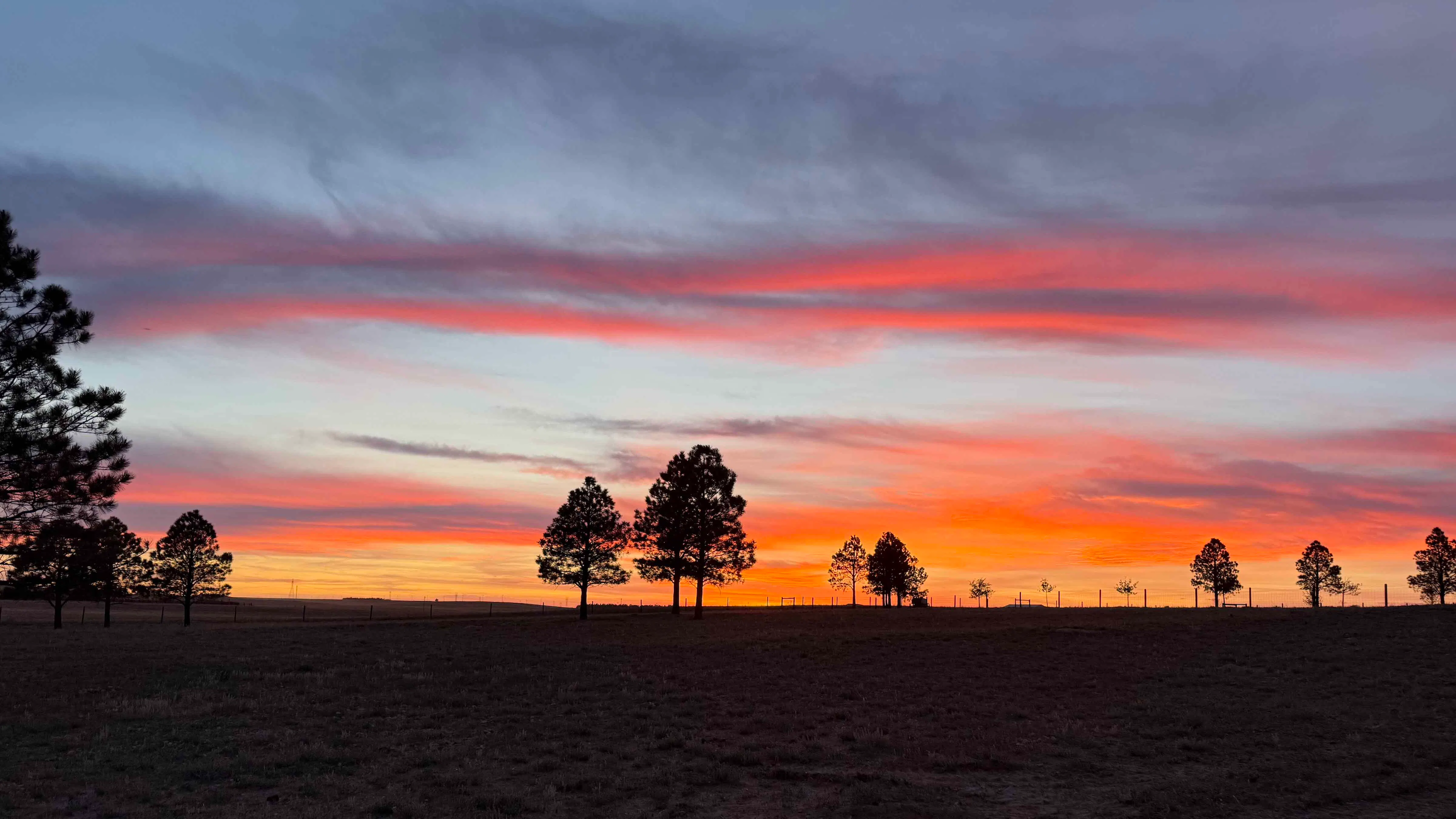 "Beautiful sunset painted by the hand of God while I was out doing some after supper landscaping."