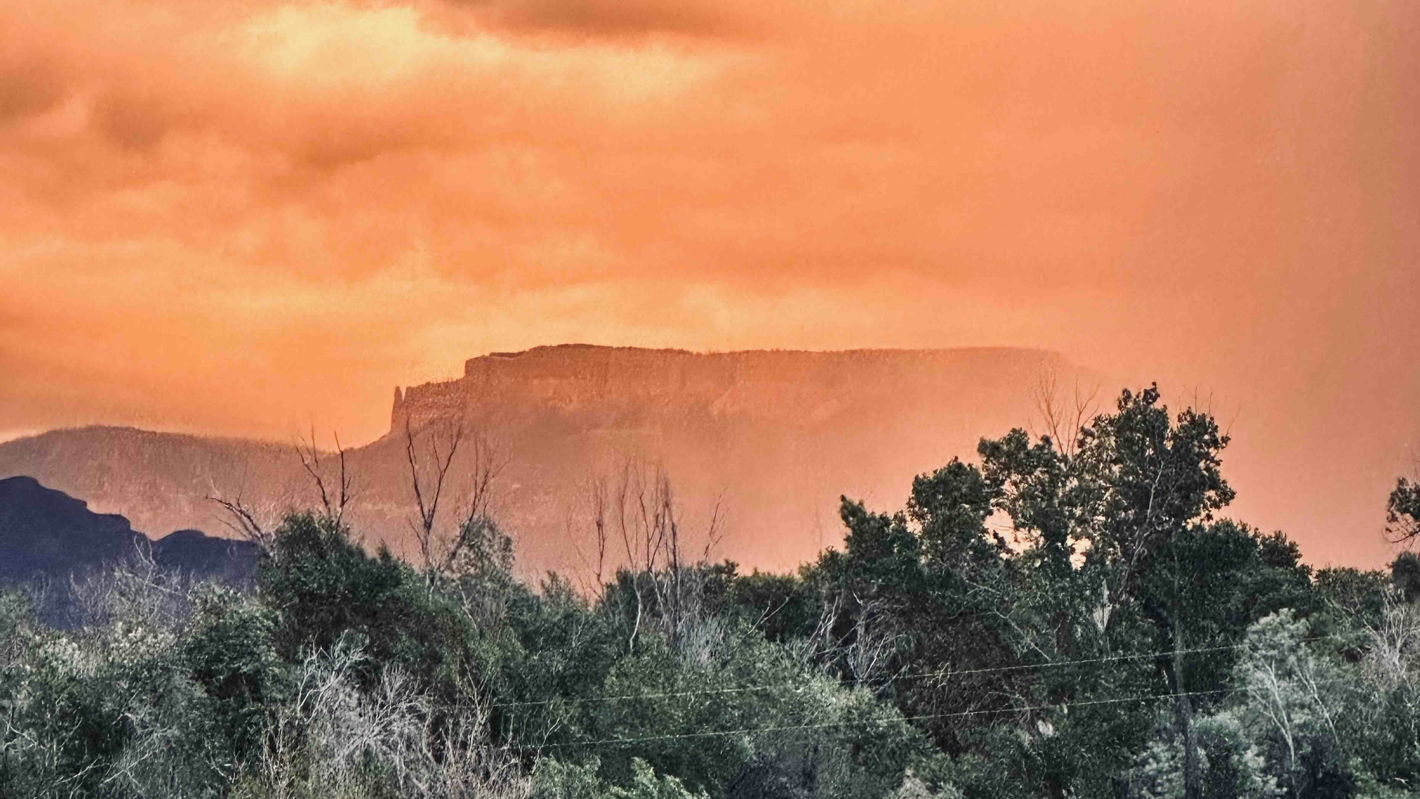 "Copman's Tomb in a summer storm at sunset. Big Horn County, Wyoming."