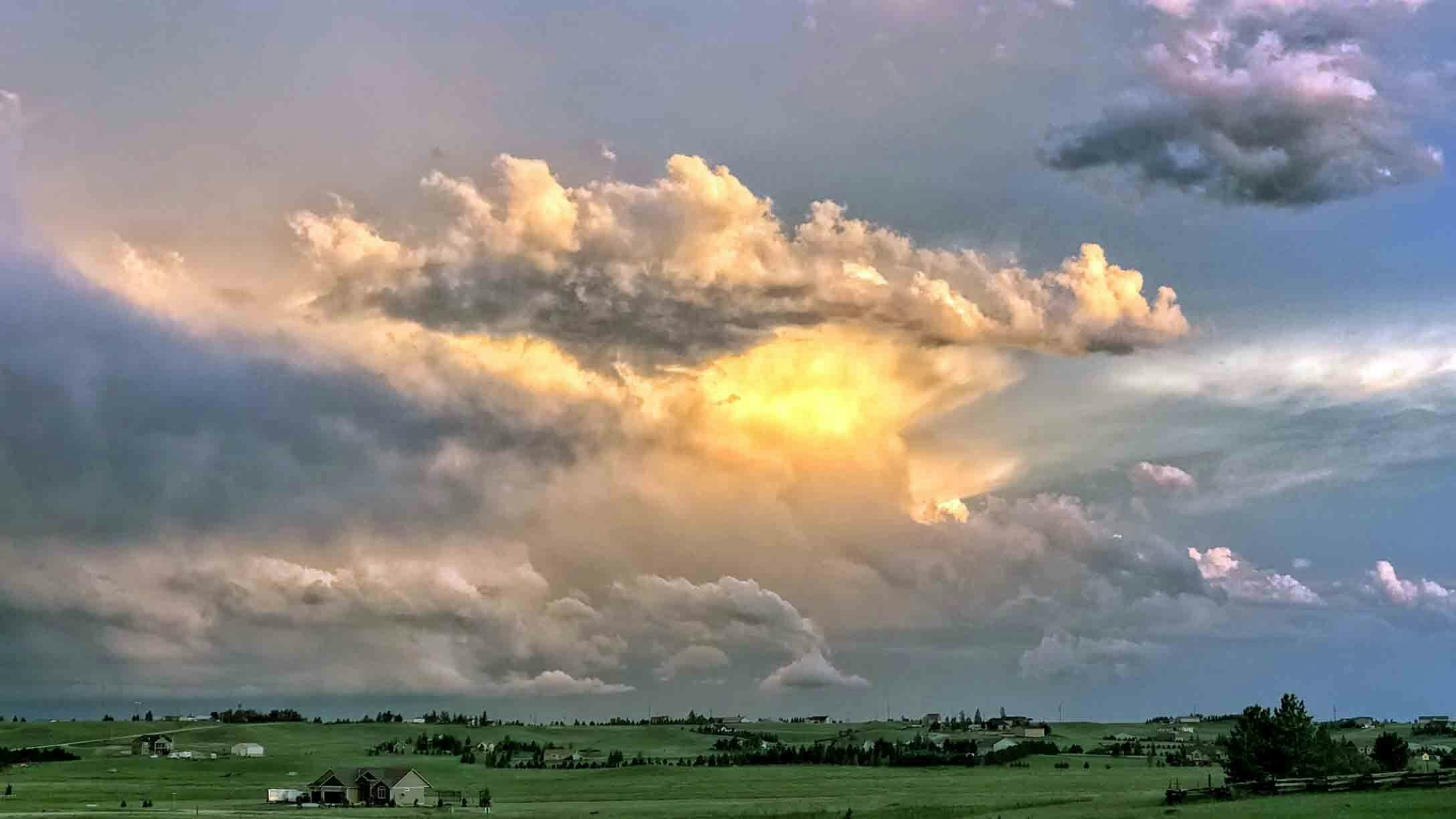 "Thunderstorm at sunset in Cheyenne. Storm was about 40 miles away and after sunset produced lots of lightning."