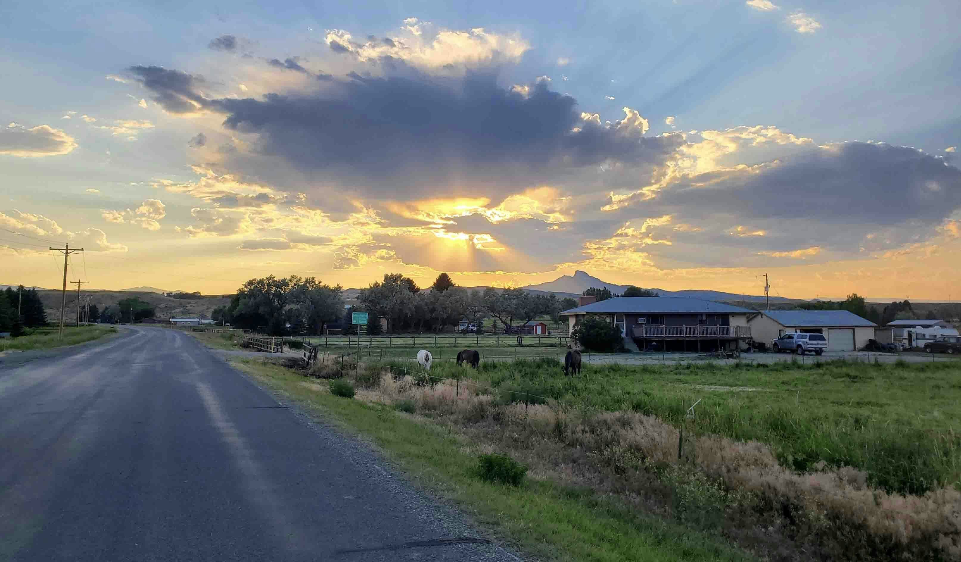 "Wednesday evening in Cody on the road to my friend's house which has some 'God light' radiating outward in all directions."