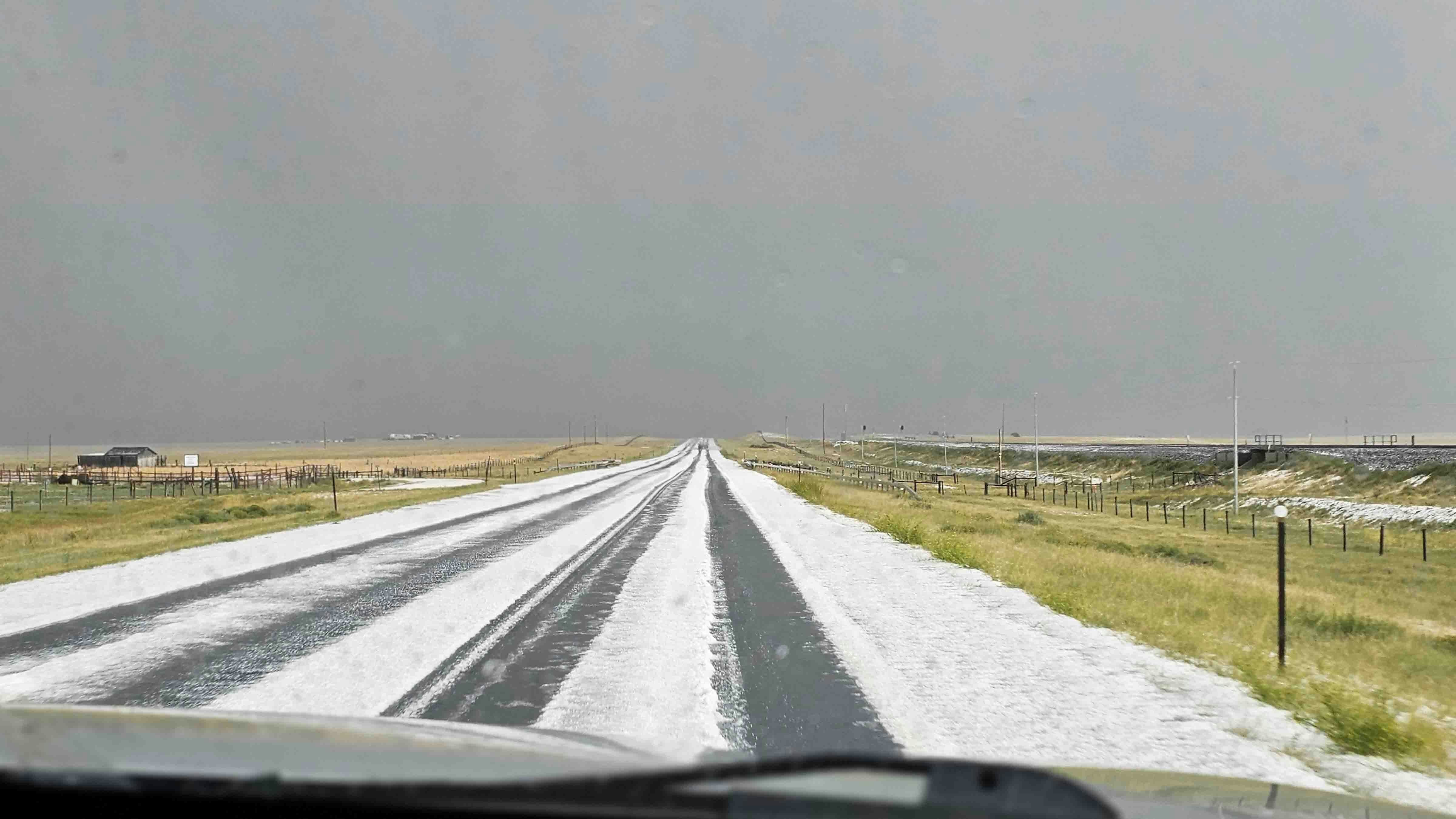 "Hail near Bosler around 3pm Sunday. Hit this on our drive back to Laramie."