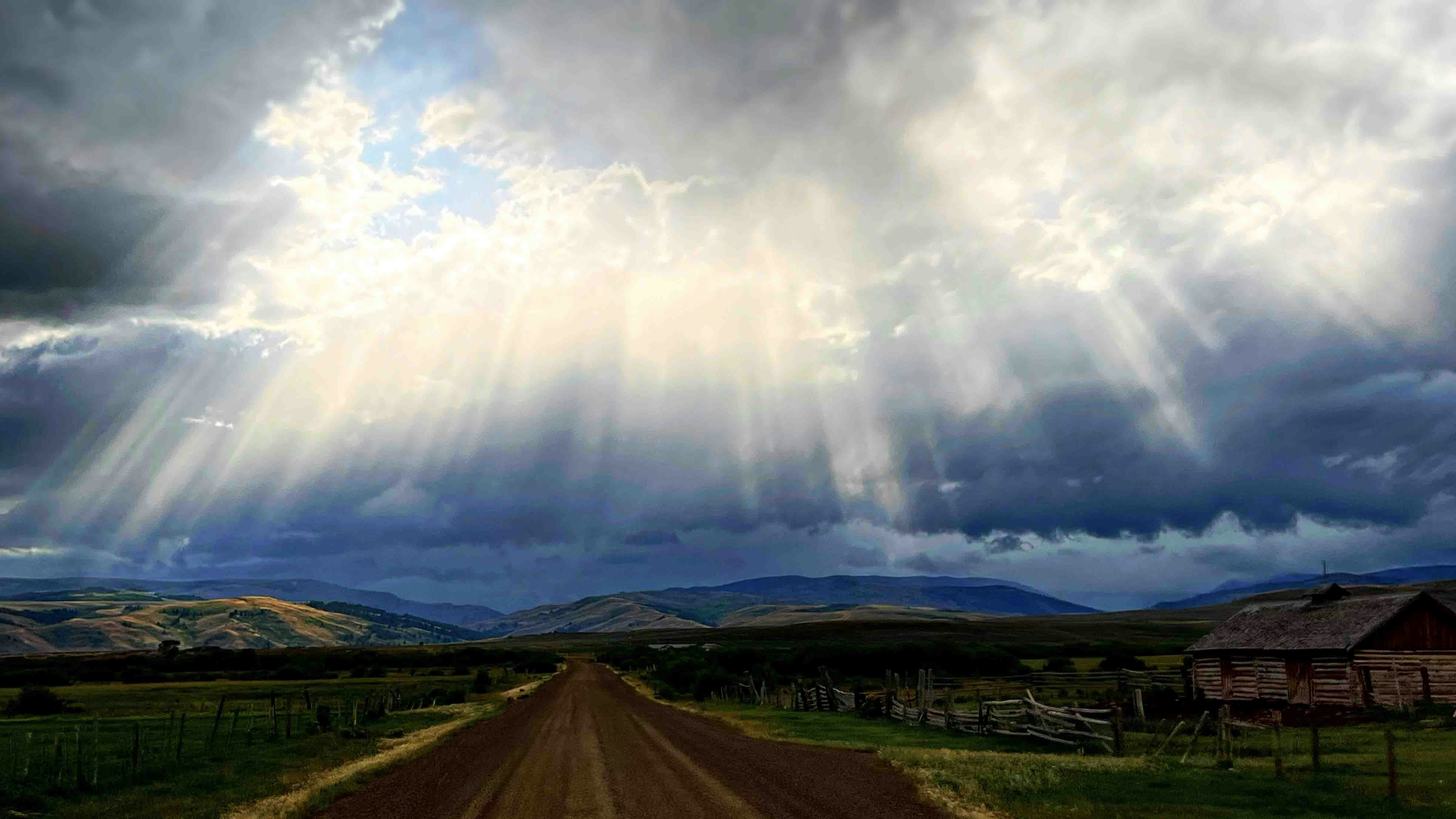 "West of Big Piney. Sun shines in a break during rain storms."