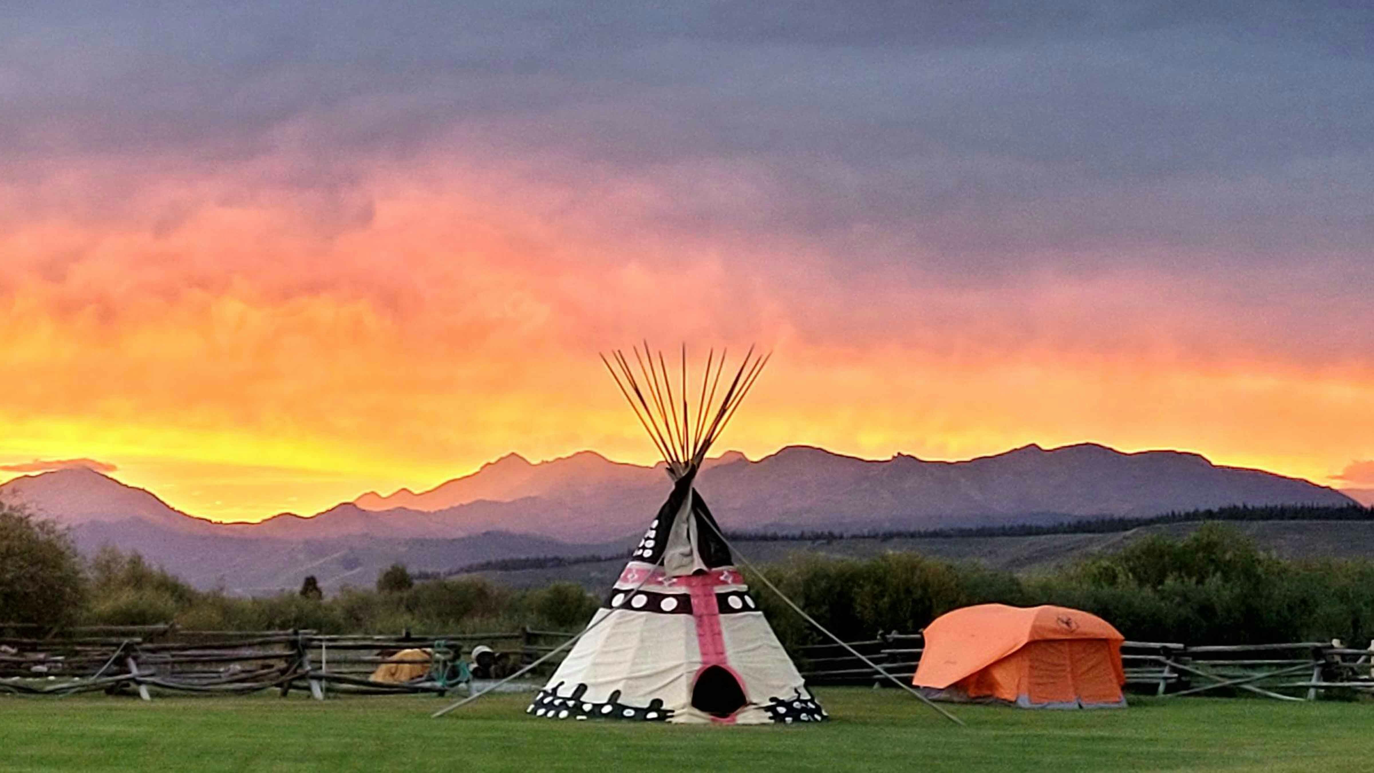 "Old tent and new tent. Sunset in Bondurant, WY on August 17, 2024."