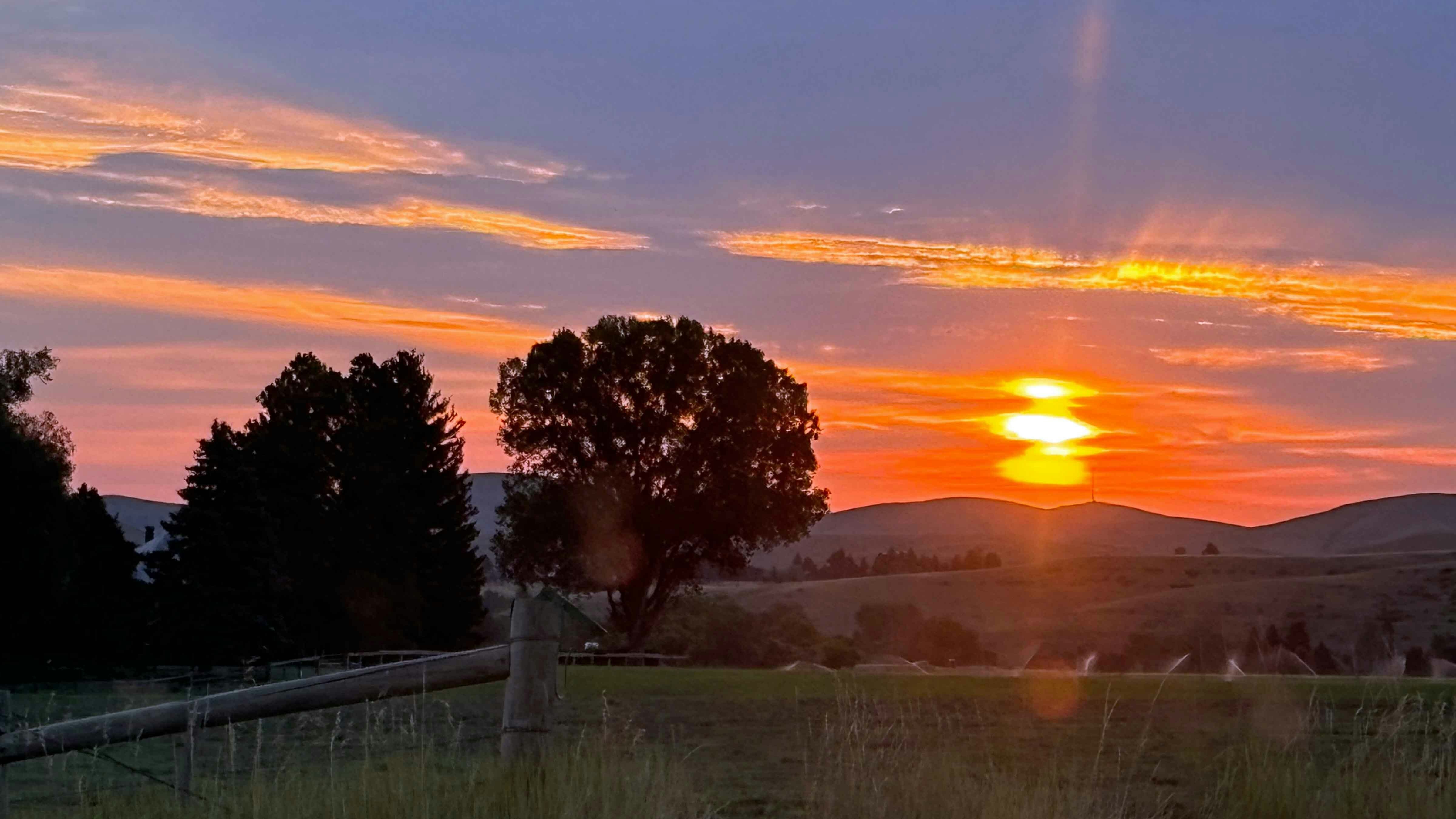 "Sunset taken on August 20, 2024, from our yard in Big Horn, Wyoming."