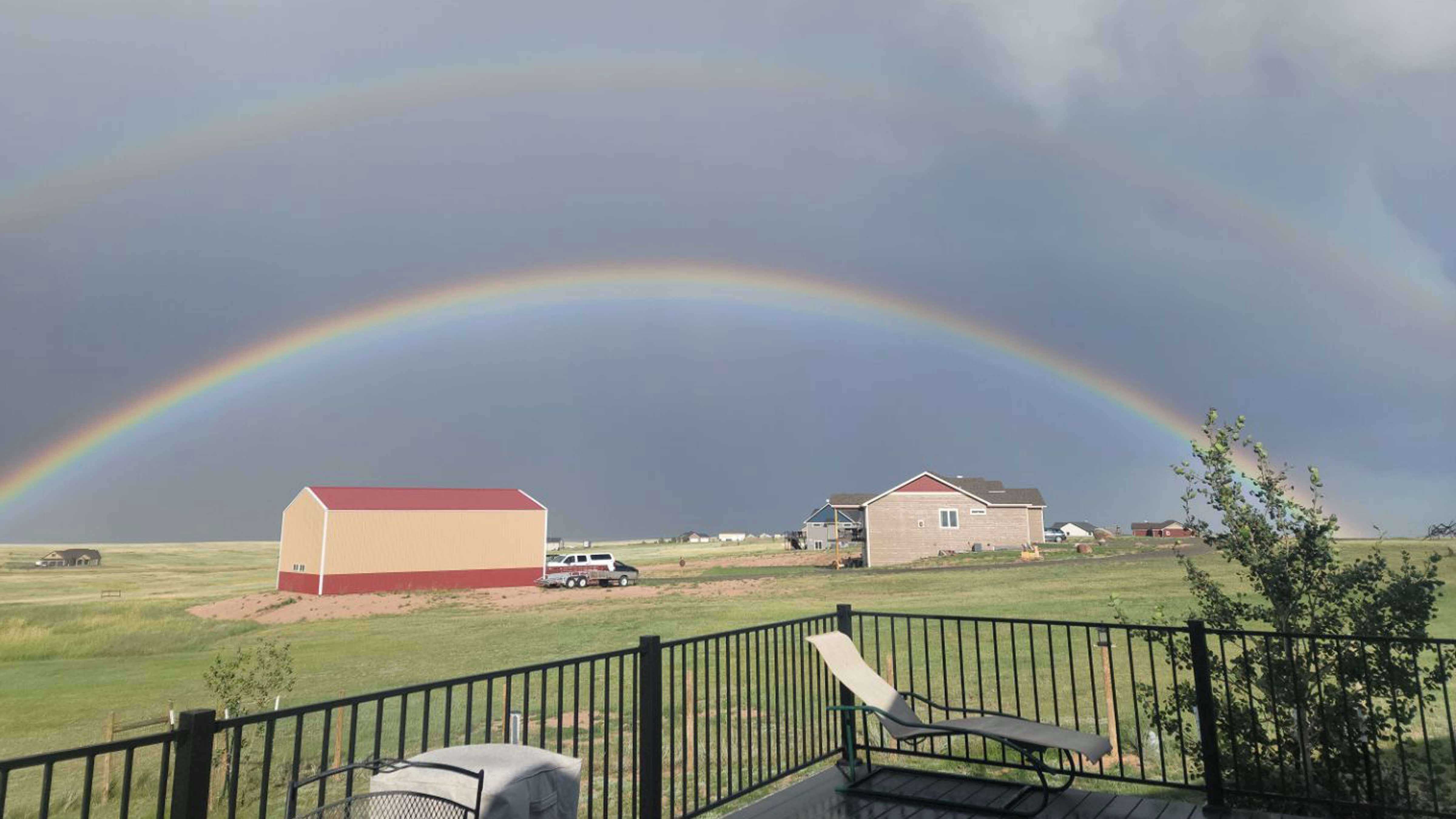 "An amazing double rainbow after a little rain. West of Cheyenne on Horsecreek. August 7, 2023
