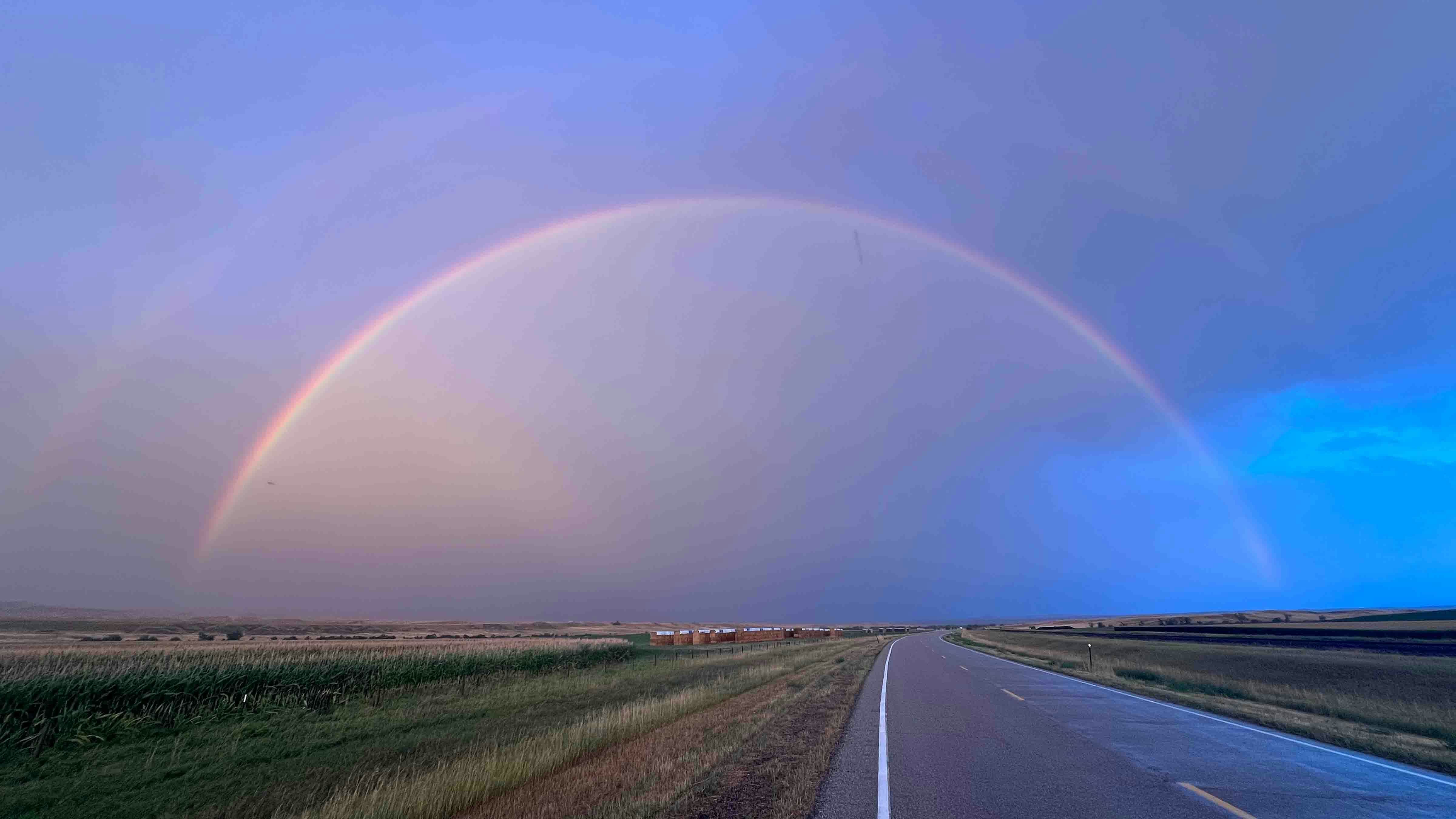 "Nearly a perfect double rainbow over the Padlock Ranch in Parkman."