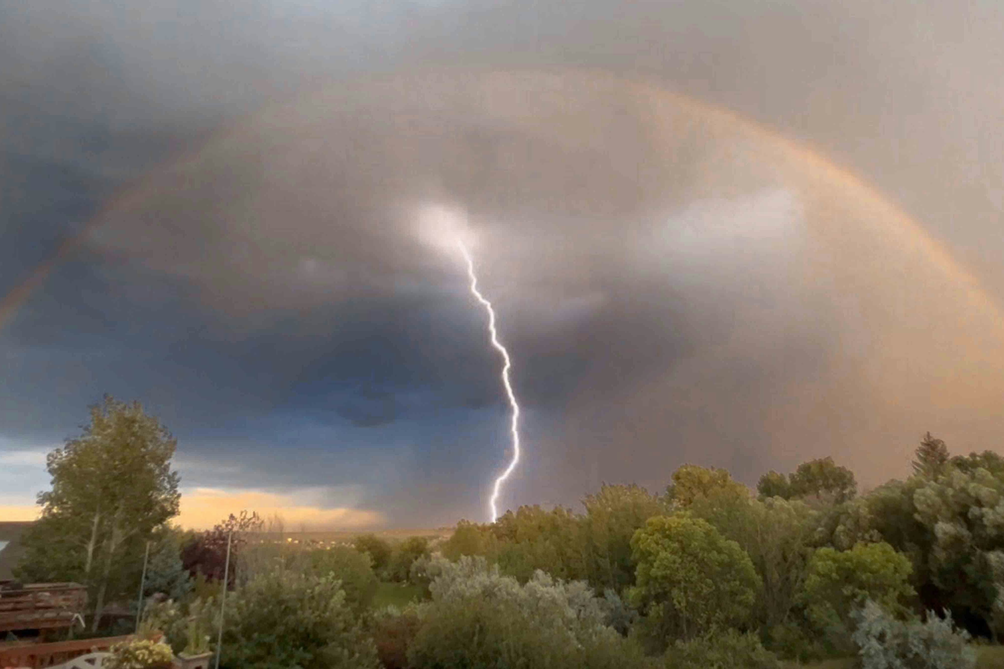 Rainbow and lightning storm near Sheridan on Sept 4, 2023