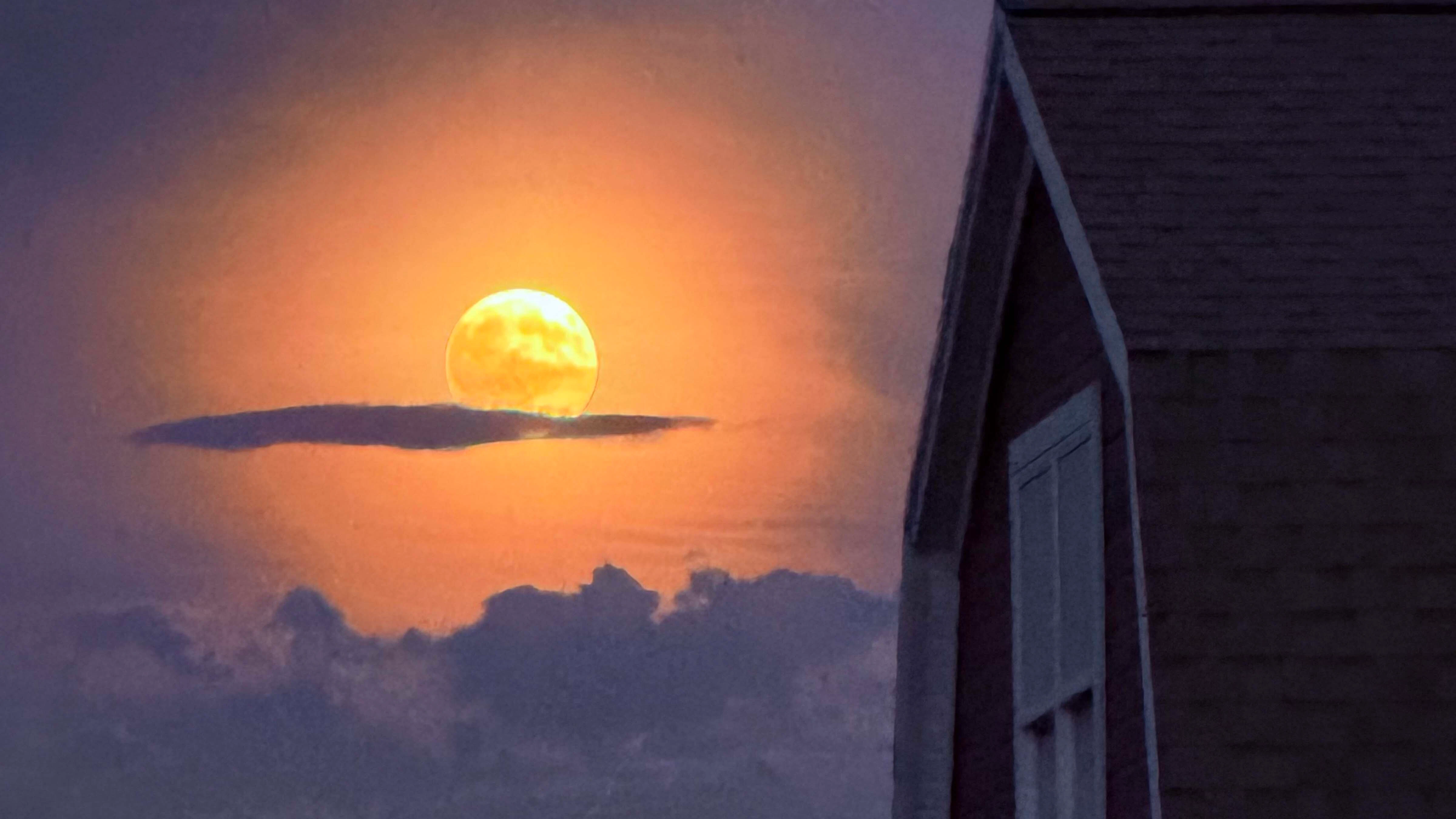 This may not be a Wyoming sunrise, but it is a Wyoming moonrise eclipse from the neighbors barn in Big Horn.
