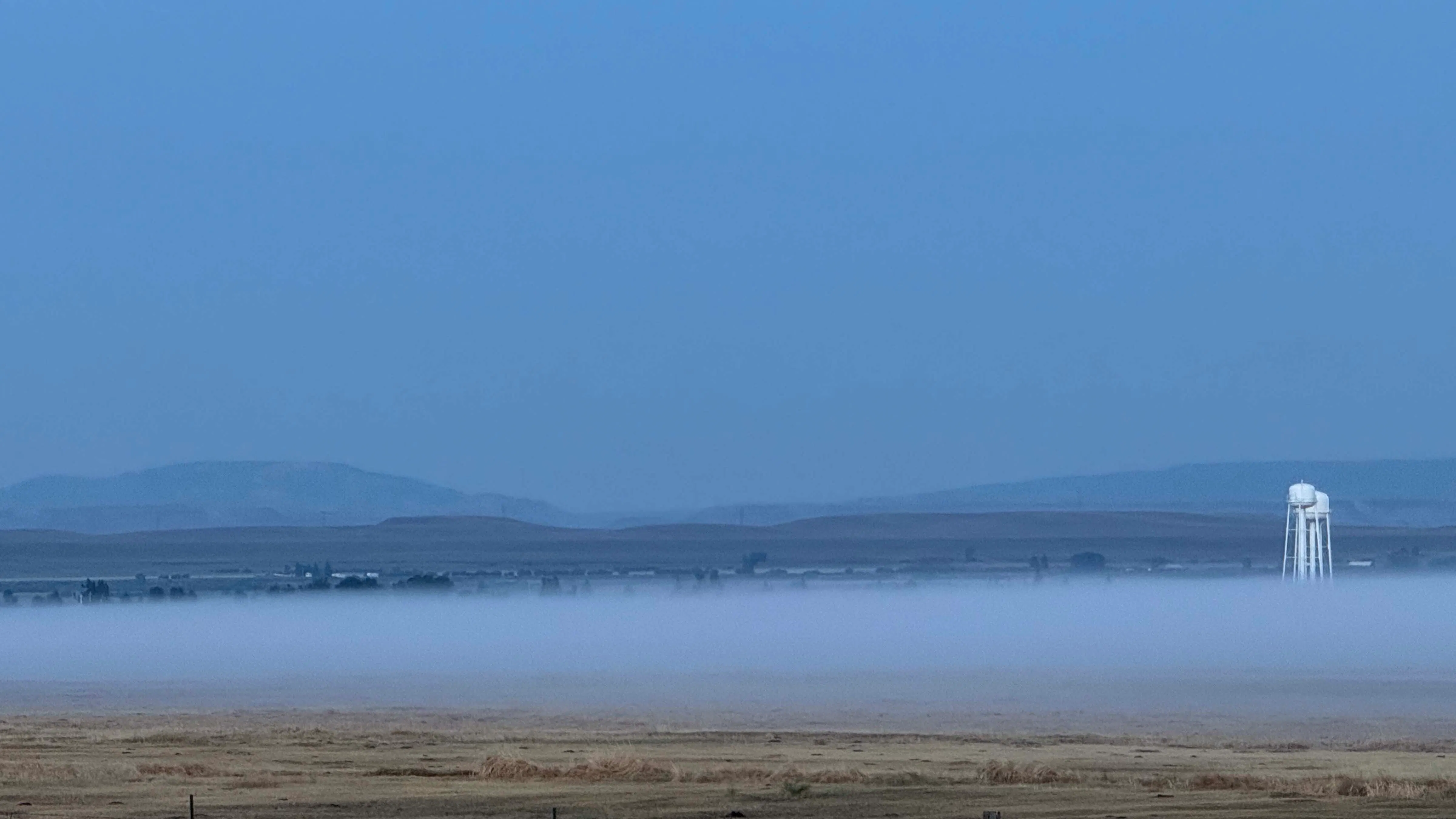 "Fog bank rolling over Big Piney."