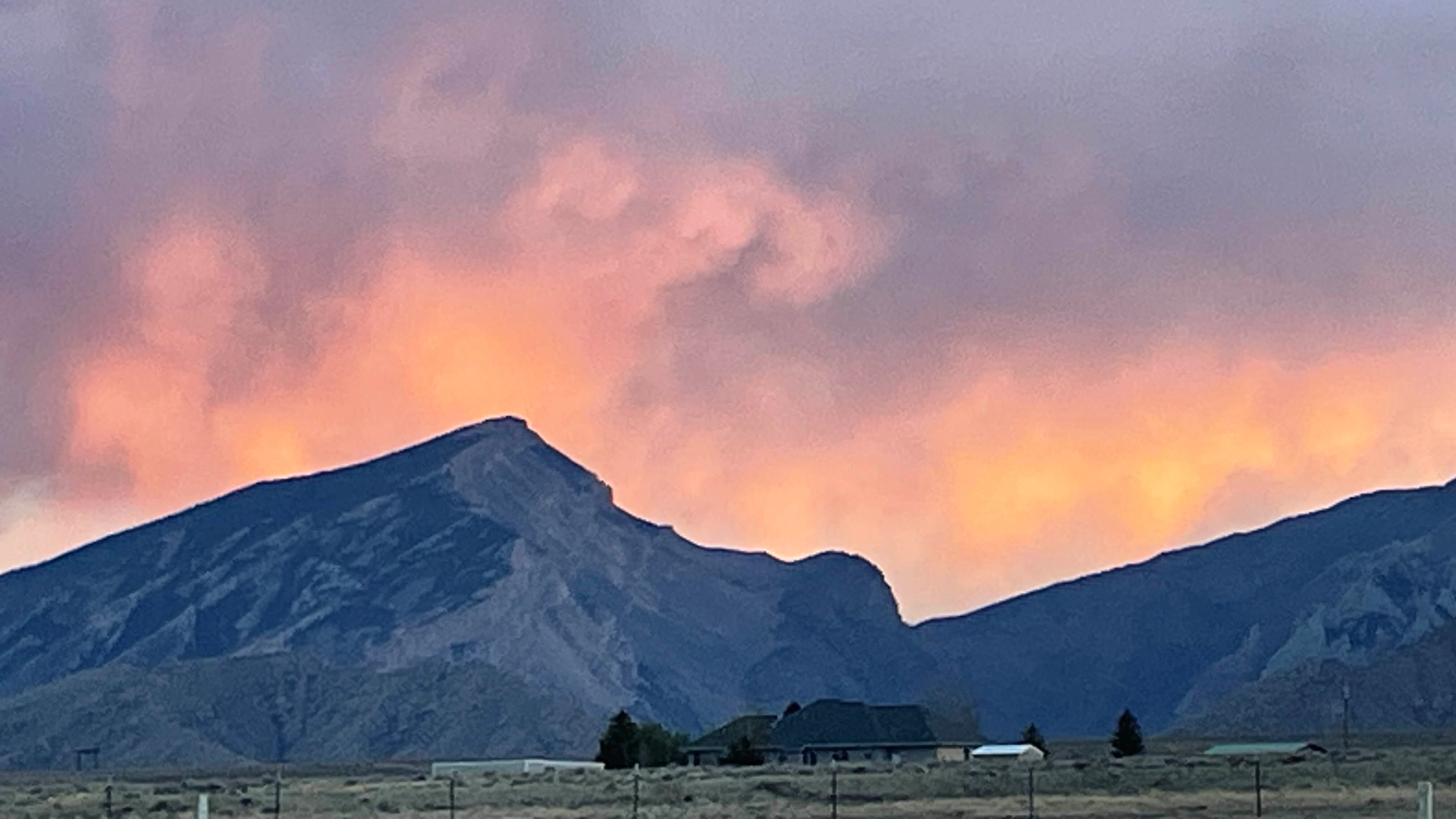 Sunset highlights the clouds and virga over the entrance to Clark’s Fork Canyon.