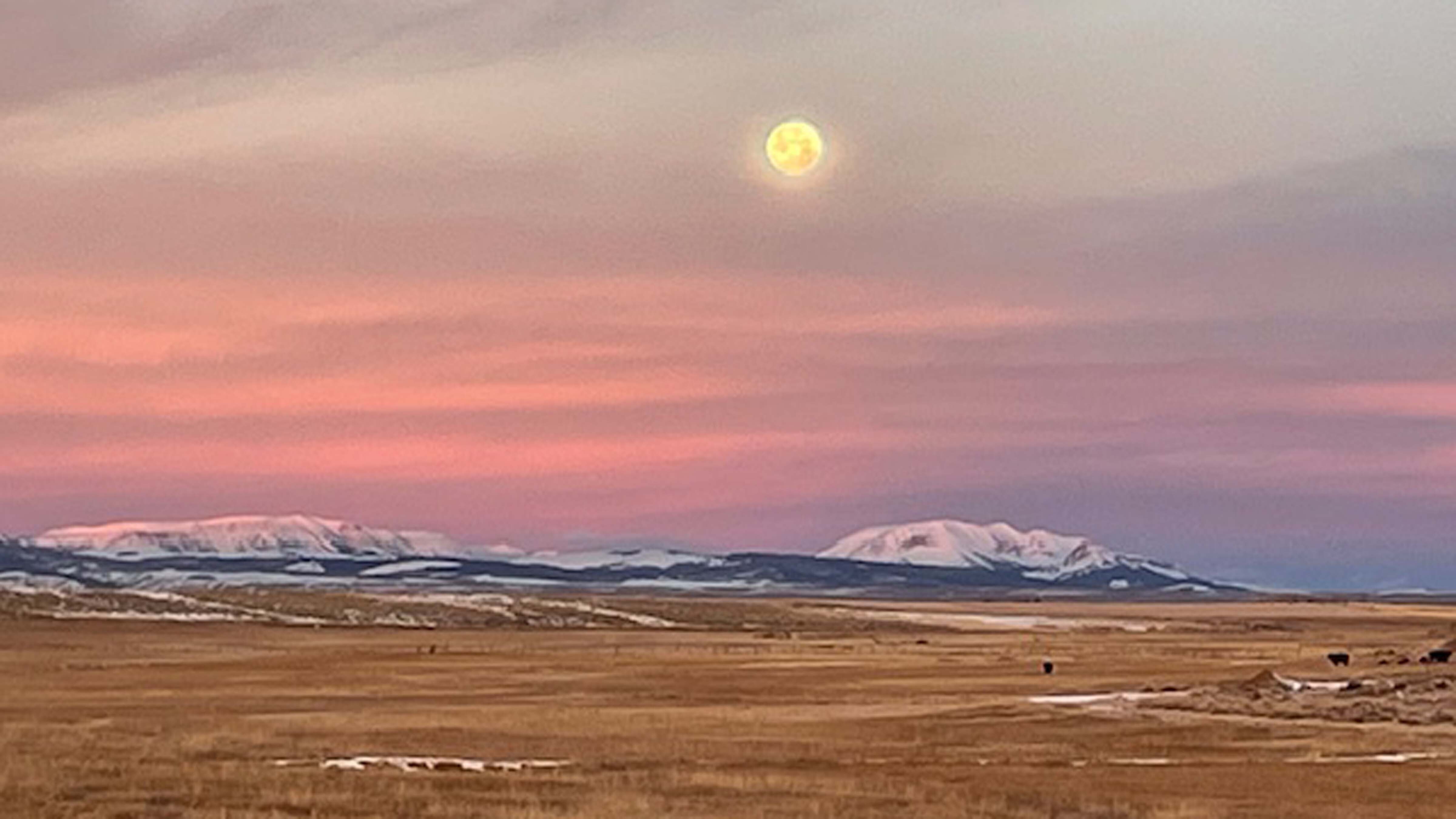 Full moon setting over the Wyoming Range seen from Big Piney