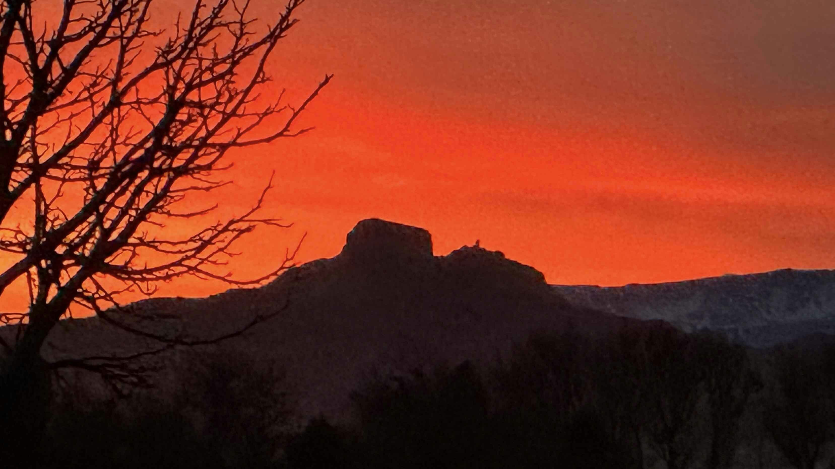 "Fire in the sky surrounding Heart Mountain"