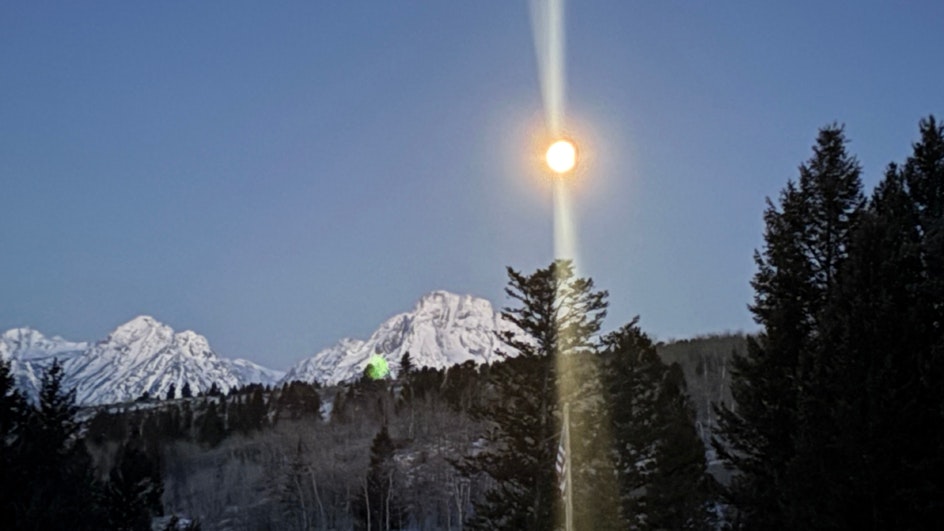 "Sunrise with full moon setting over Mt. Moran Teton Range...I believe ice crystals in the air from Jackson Lake or the Snake River make this photo mystical"