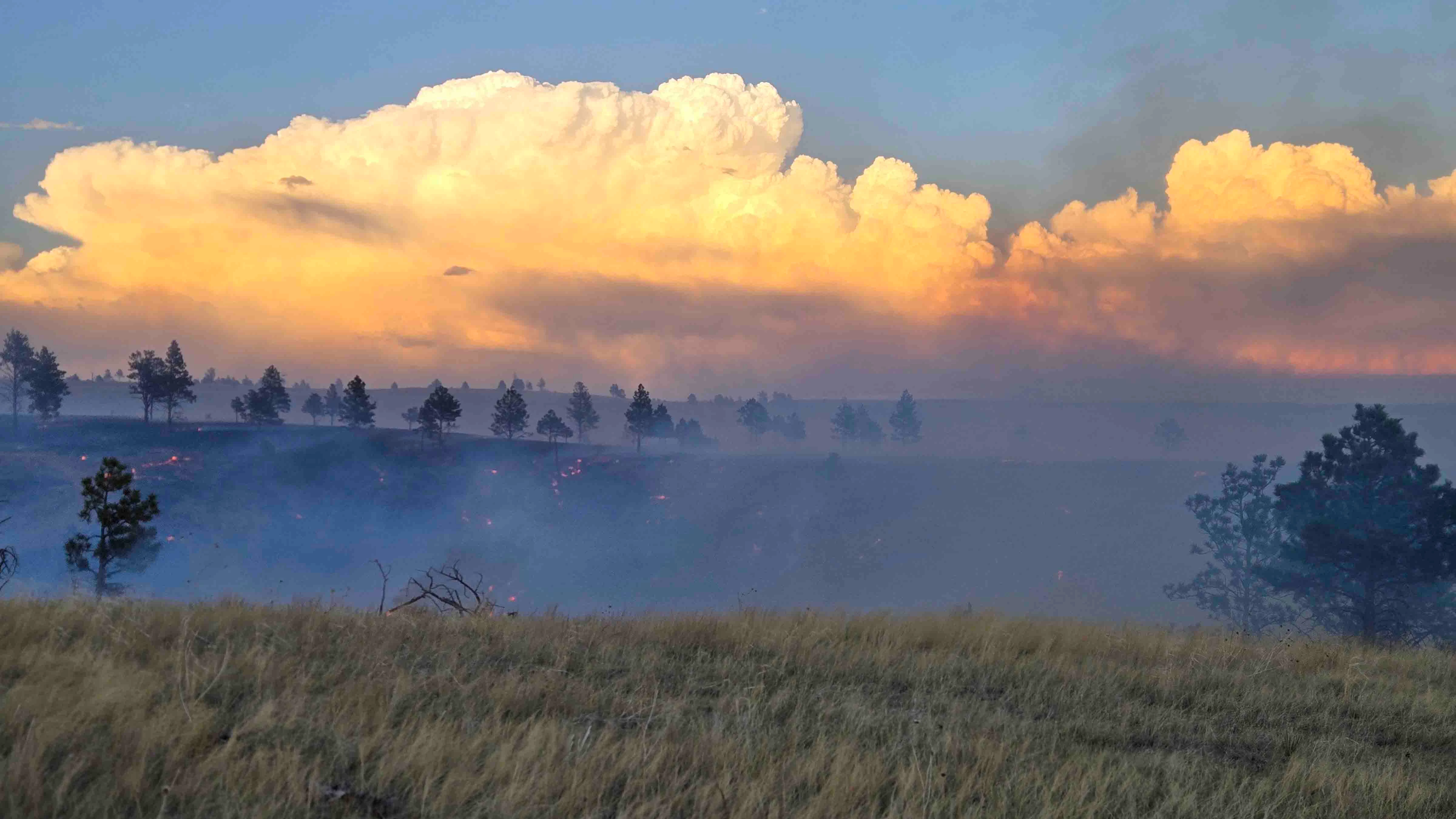 "Storm clouds at sunset on the Sand Creek Fire in Weston County."