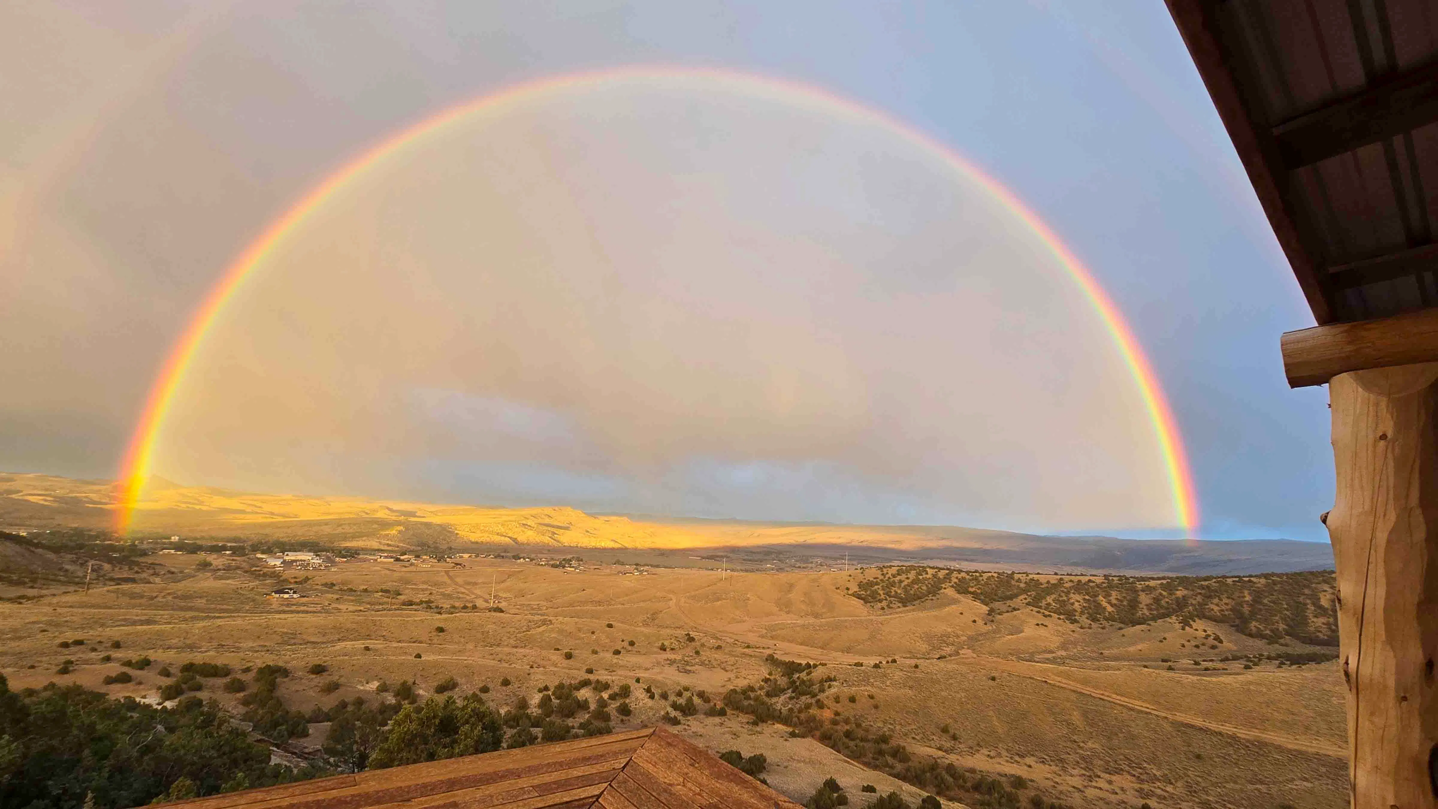 Magnificent rainbow during much needed rain this evening taken from our porch in Thermopolis.